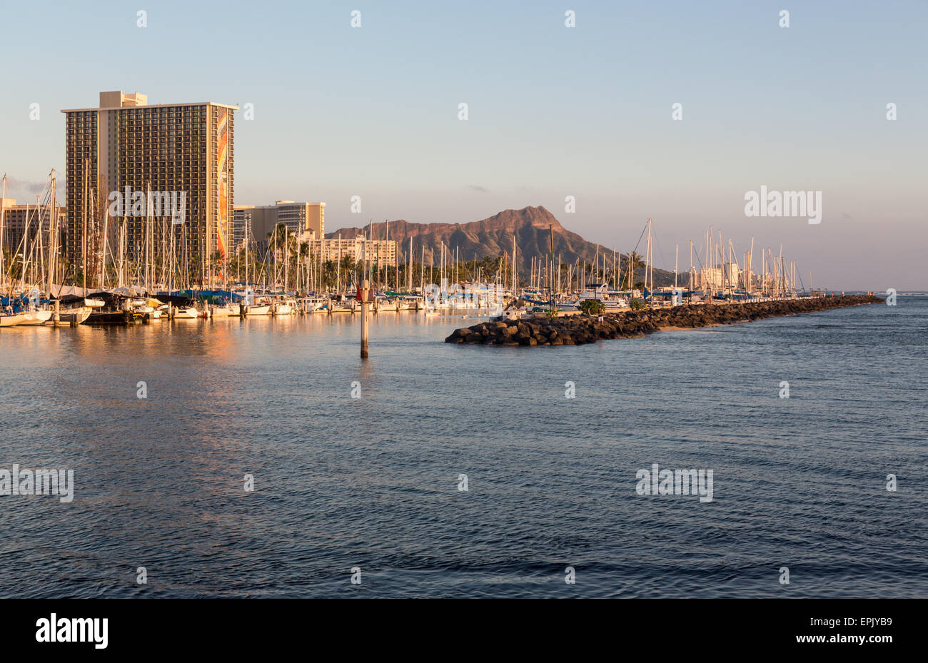 Yachts in Ala Moana harbor frame Diamond Head Stock Photo