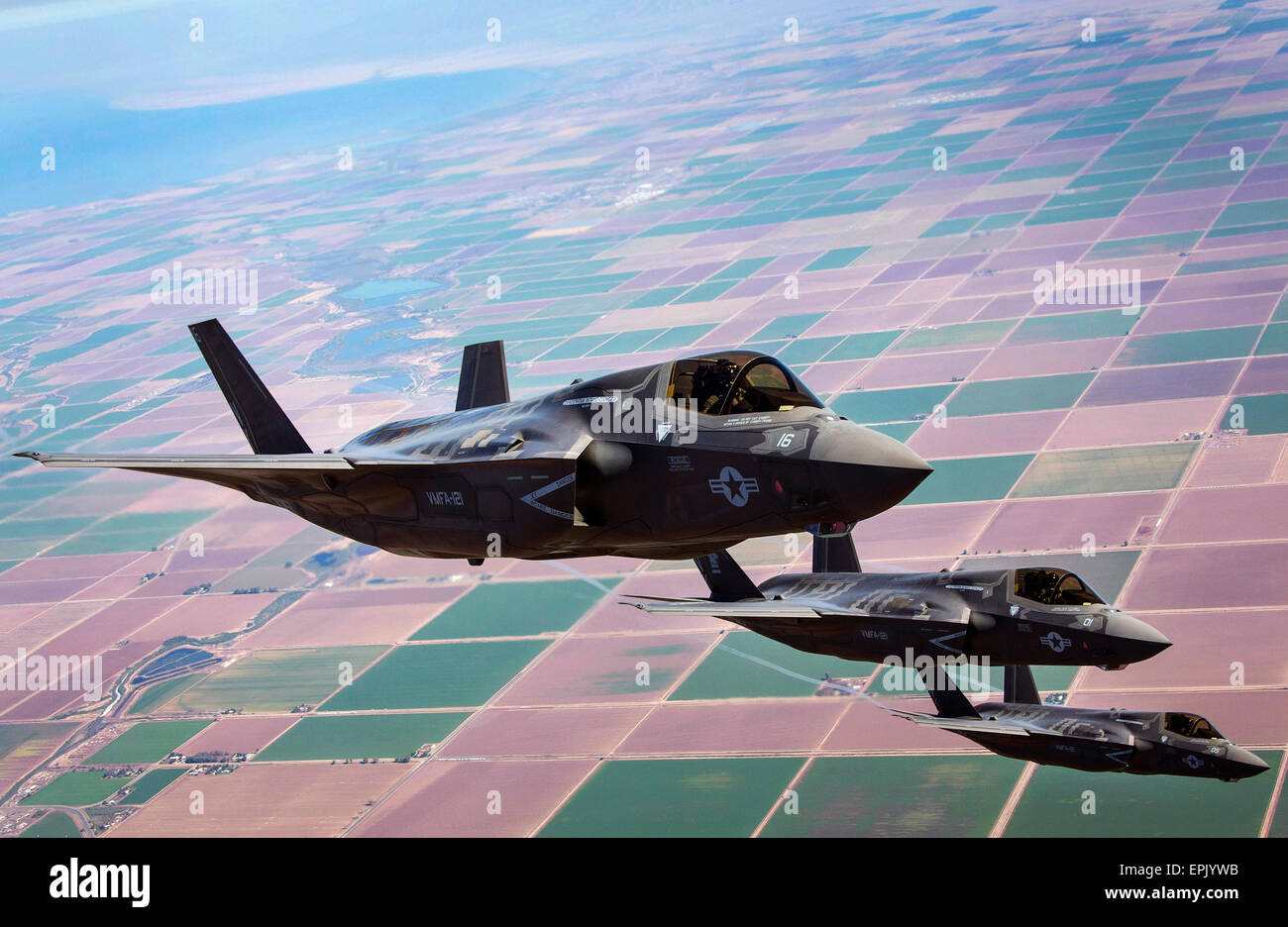 U.S. Marine Corps F-35B Lightning II Joint Strike Fighters fly in formation during fixed-wing aerial refueling training exercise August 27, 2013 over eastern California. Stock Photo