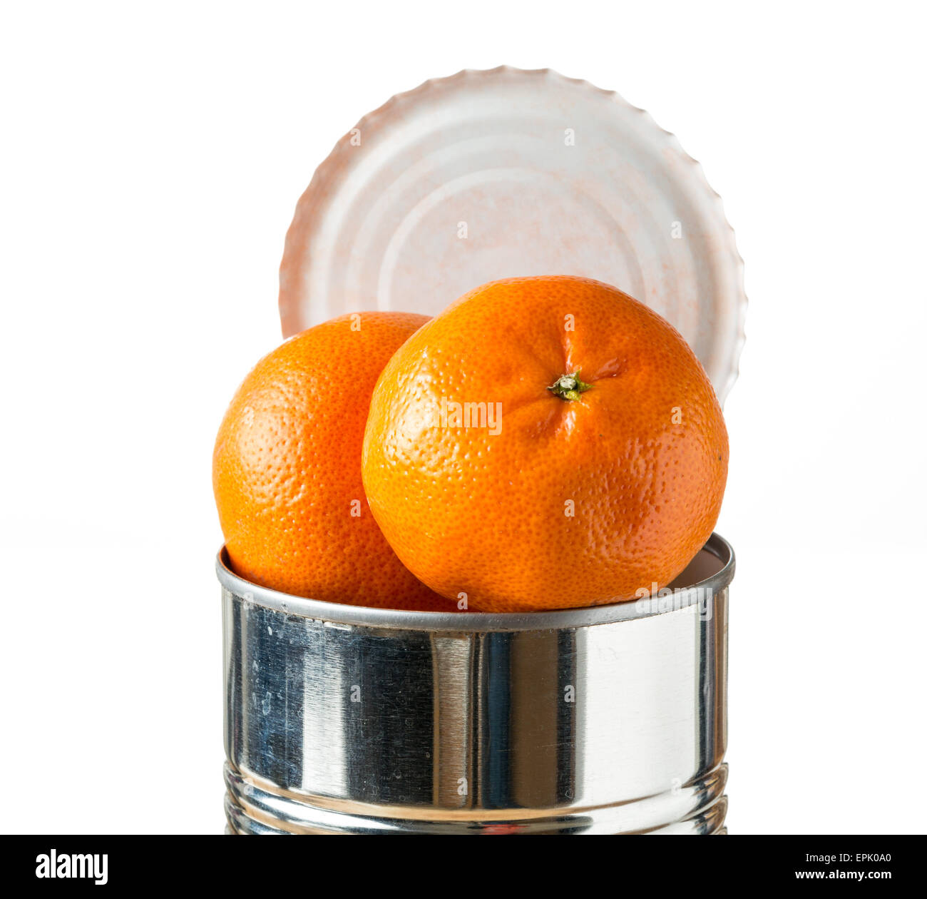 Oranges bursting out of tin can Stock Photo