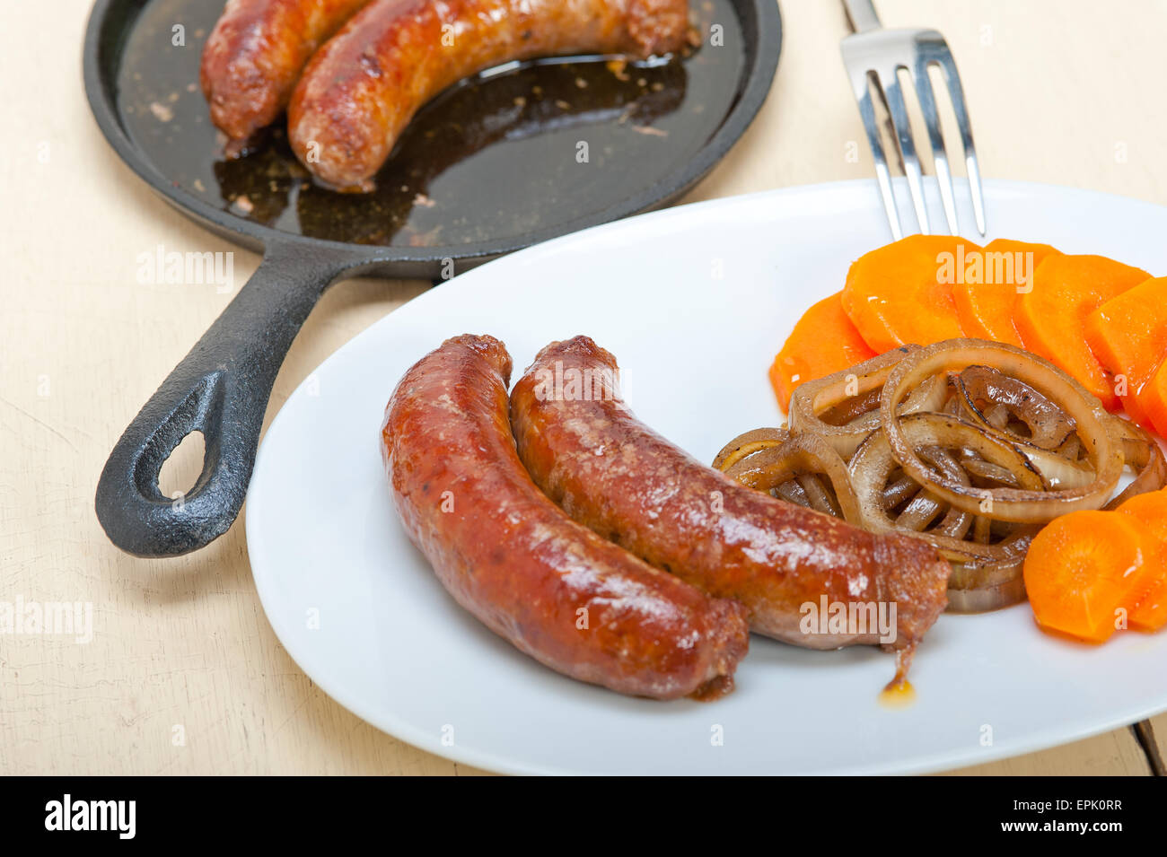 beef sausages cooked on iron skillet Stock Photo Alamy