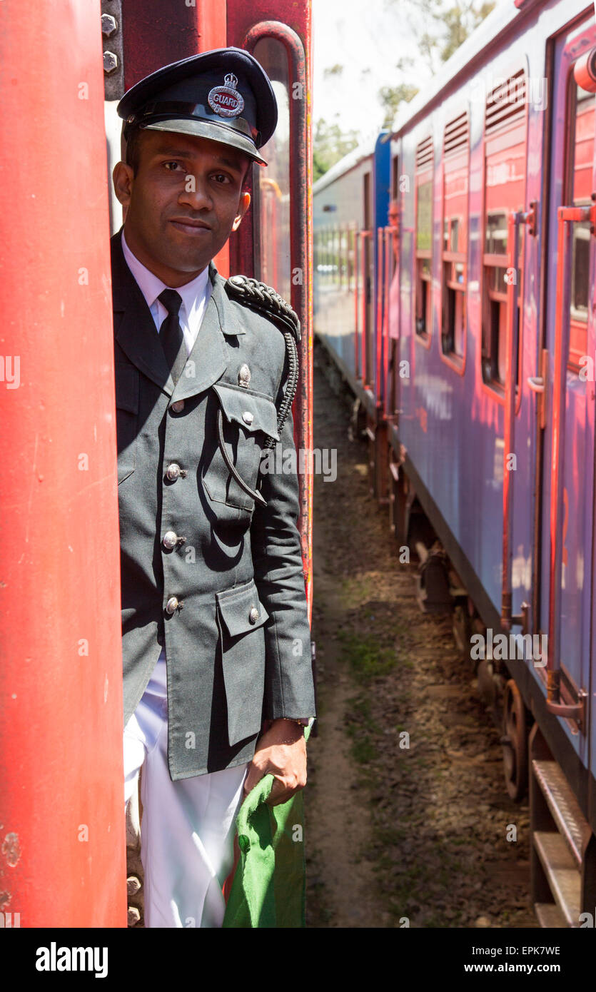 Male railway guard standing on a train Sri Lanka, Asia Stock Photo