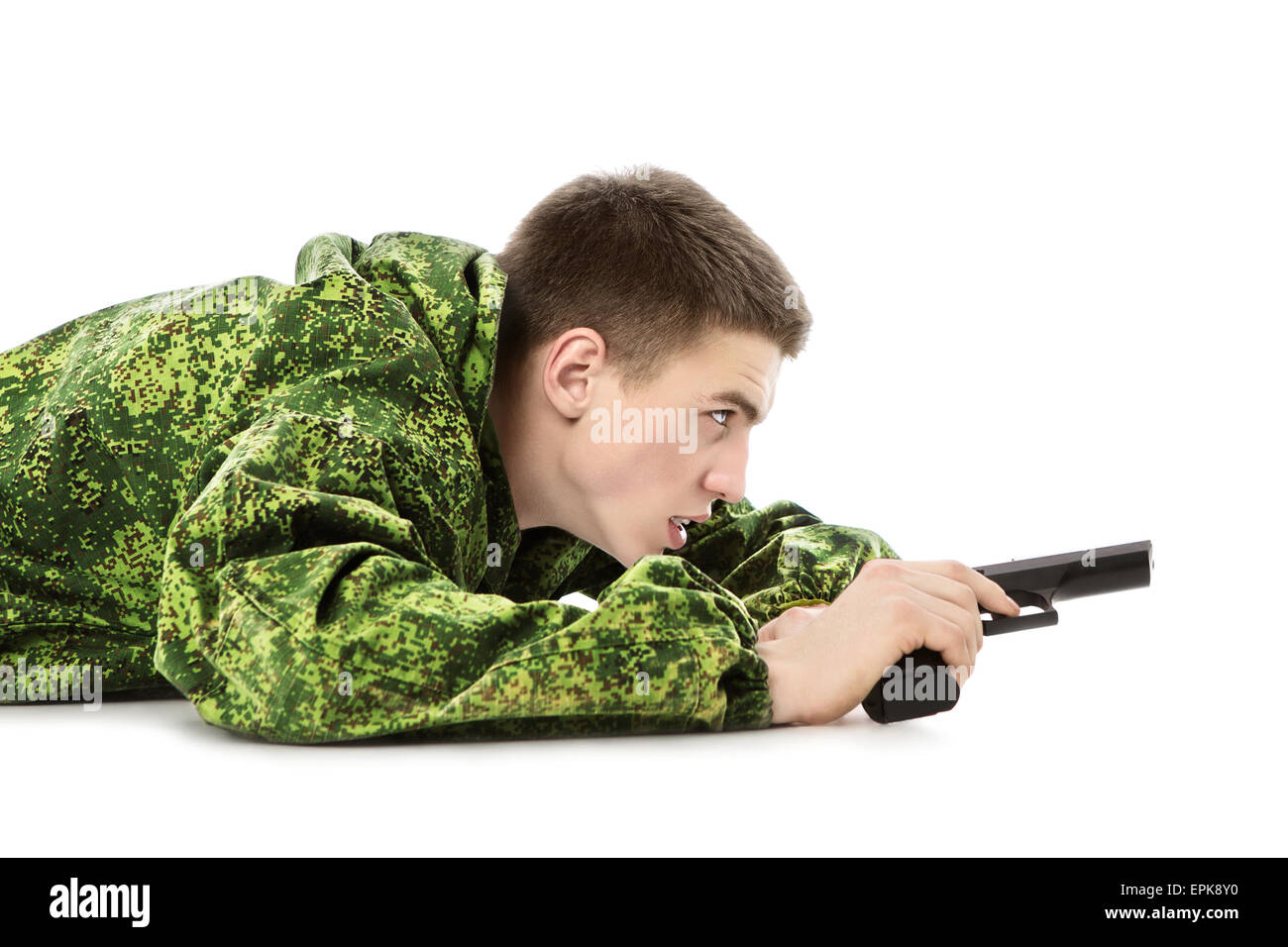 young military man with gun, isolated on white Stock Photo