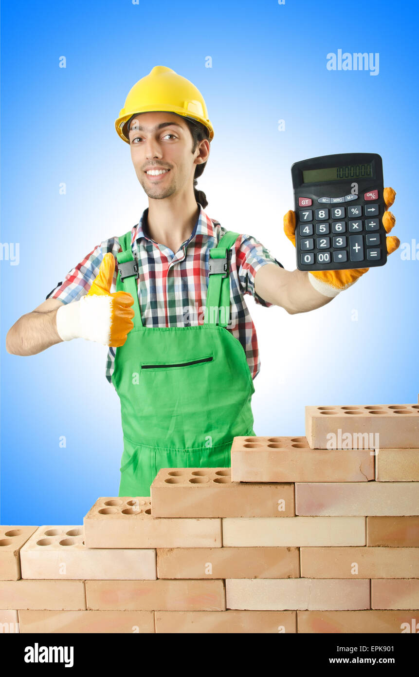 Expensive construction concept with builder and calculator Stock Photo