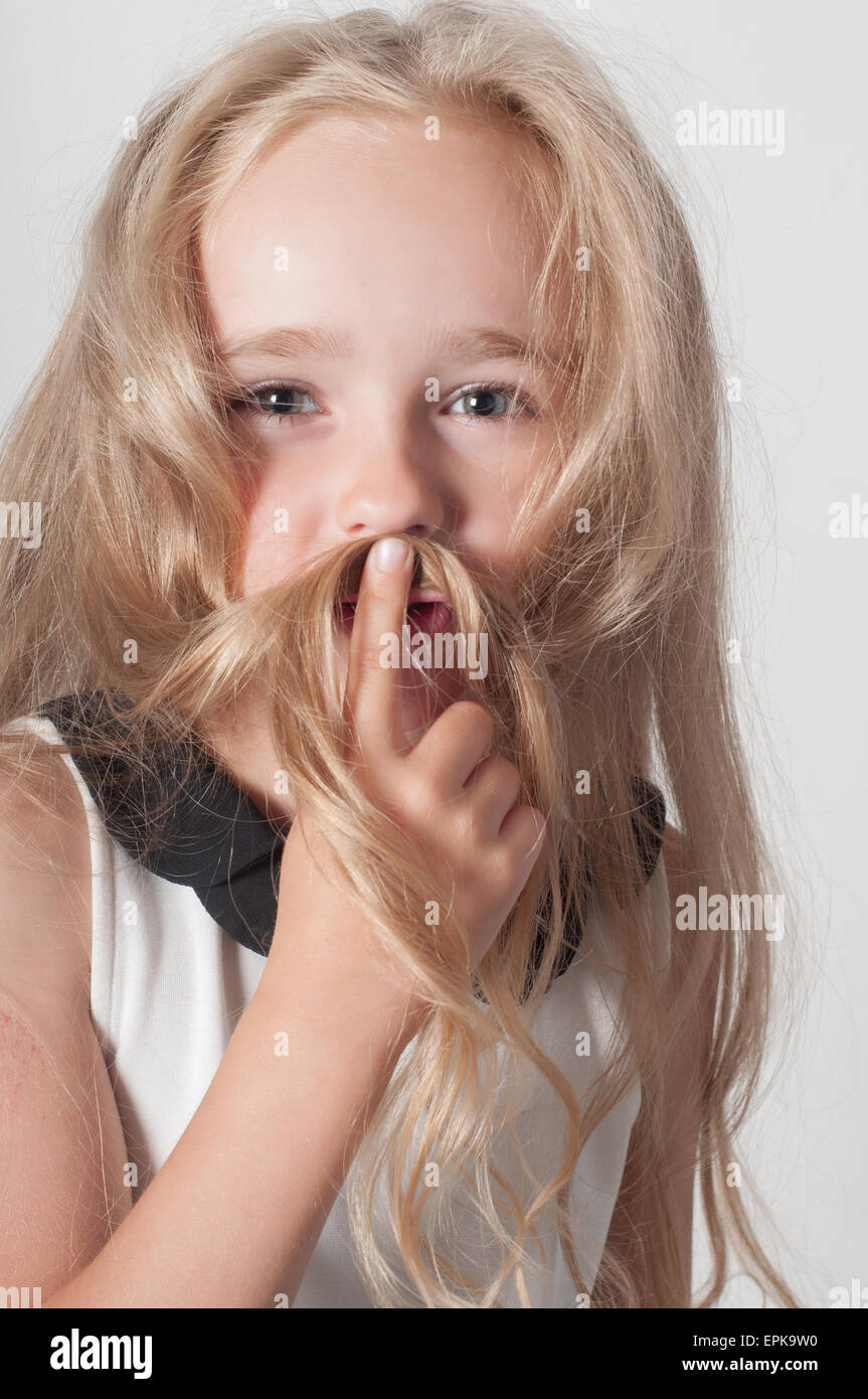 Little girl with long hair fooling around Stock Photo