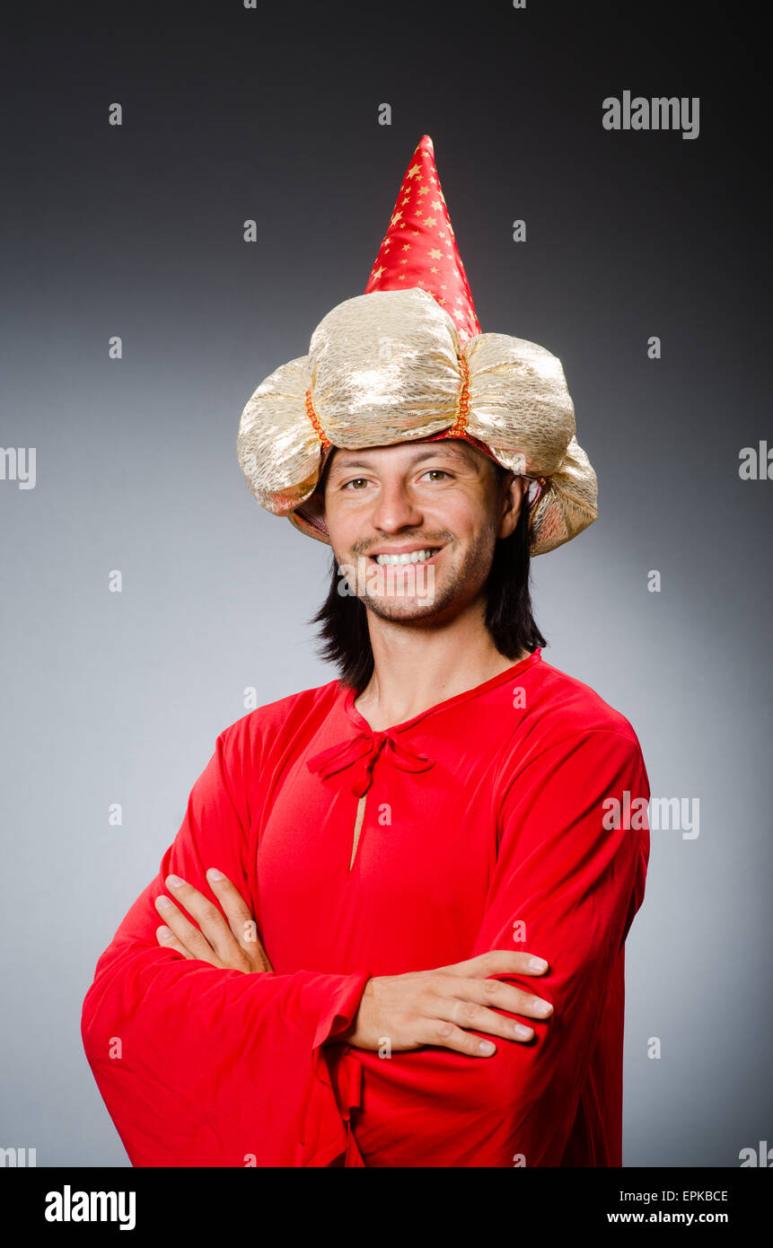 Funny wizard wearing red dress Stock Photo - Alamy