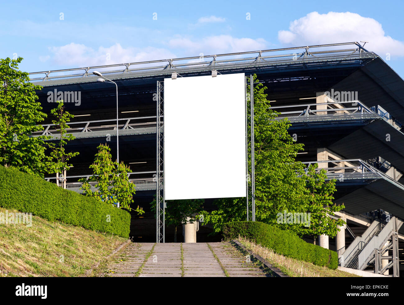 Vertical blank billboard in front of car parking facility Stock Photo ...