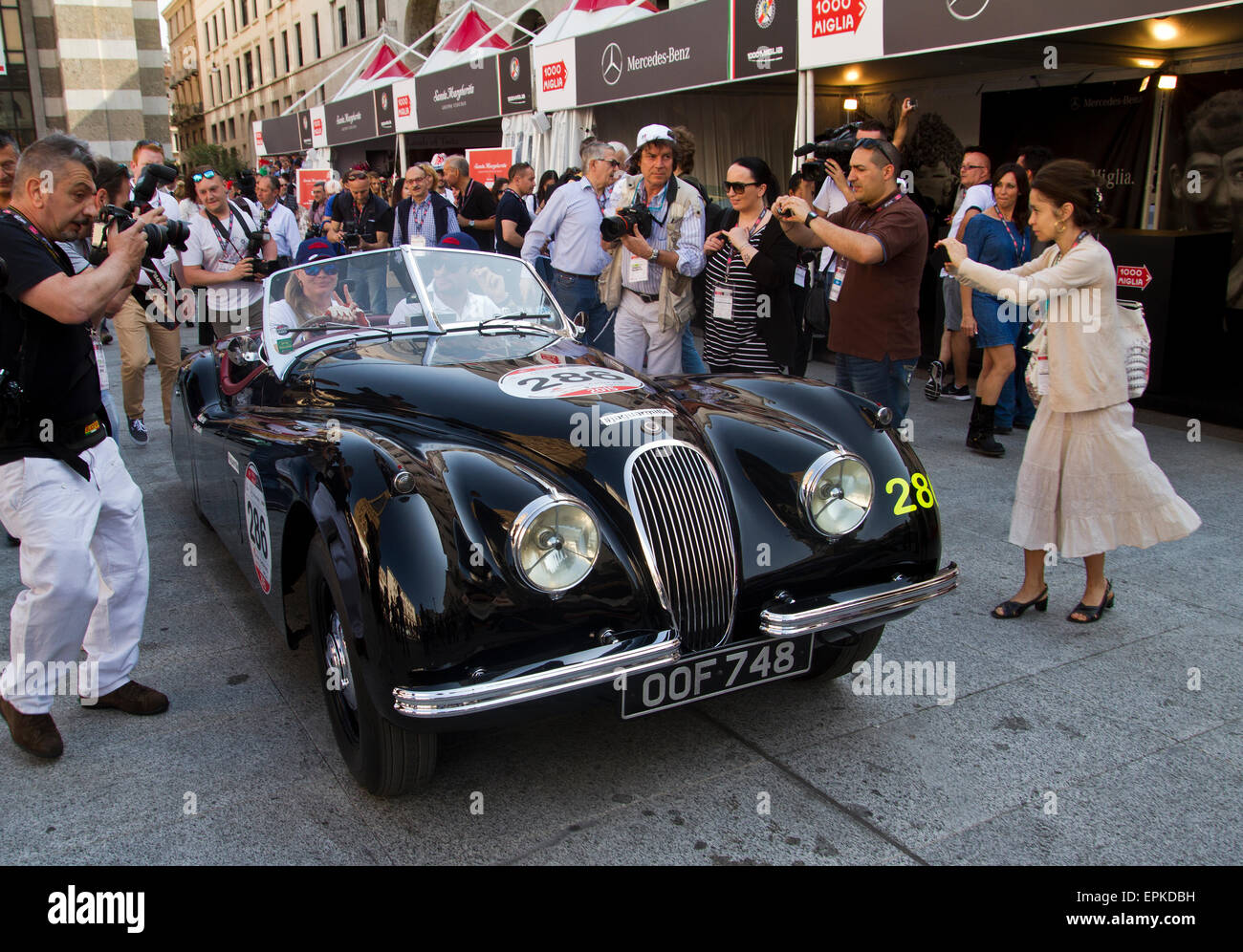 models Jodie Kidd and David gandy in Piazza Vittoria for the start of the classic Italian road race the Mille Miglia from Brescia to Rome and back again covering 1000 miles. 14.05.2015 Stock Photo