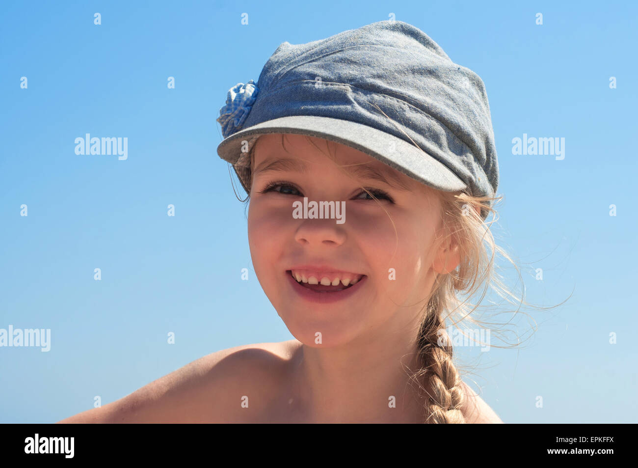 Adorable happy little girl in denim cap Stock Photo Alamy
