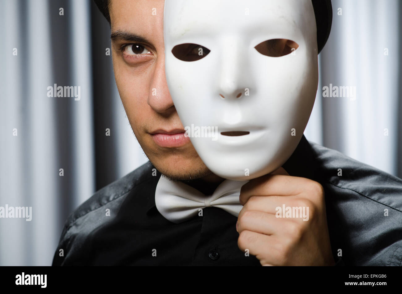 Funny concept with theatrical mask Stock Photo - Alamy