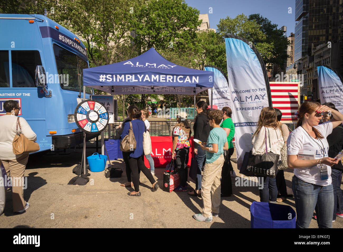 Hundreds of women turn out for the Almay Simply American branding event in Flatiron Plaza in New York on Friday, May 15, 2015. The beauty company gave away product samples, American food, and makeup touchups and with each social media post from the participants the company donated $1 to the USO. Alamy also gave $250,000 to the USO.  (© Richard B. Levine) Stock Photo