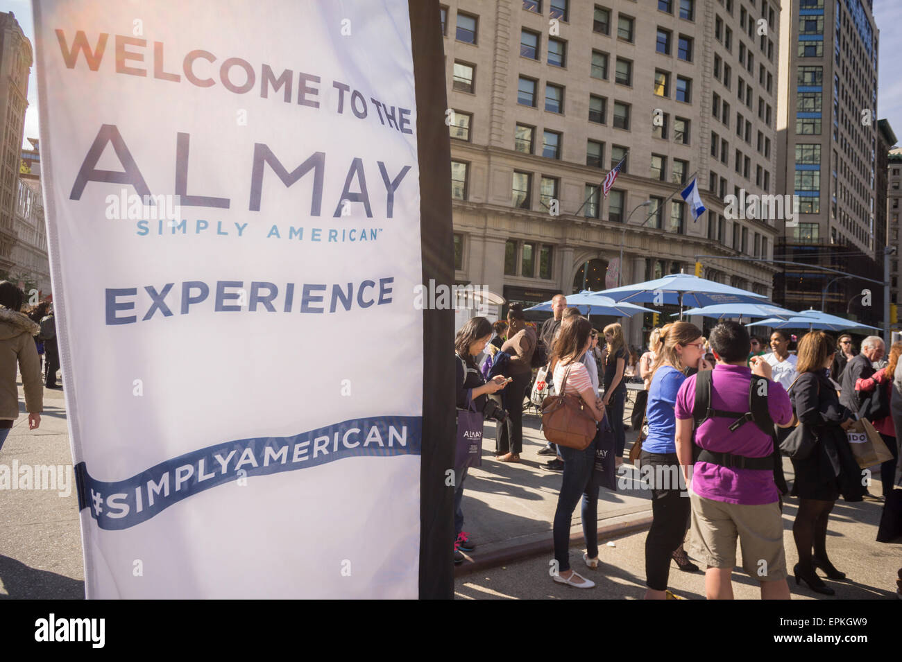 Hundreds of women turn out for the Almay Simply American branding event in Flatiron Plaza in New York on Friday, May 15, 2015. The beauty company gave away product samples, American food, and makeup touchups and with each social media post from the participants the company donated $1 to the USO. Alamy also gave $250,000 to the USO.  (© Richard B. Levine) Stock Photo