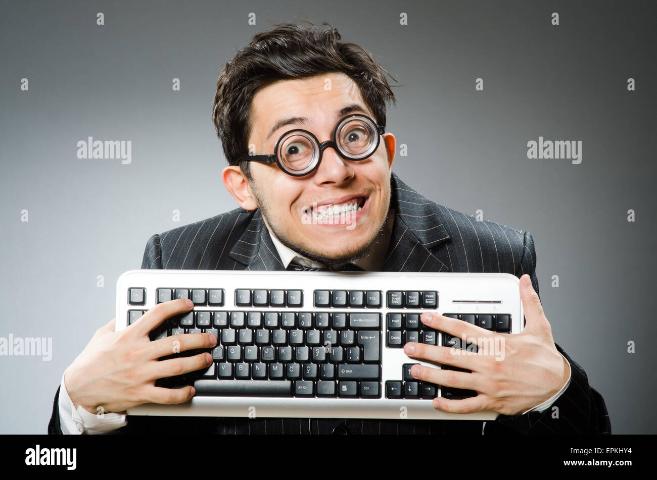 Computer geek with computer keyboard Stock Photo - Alamy