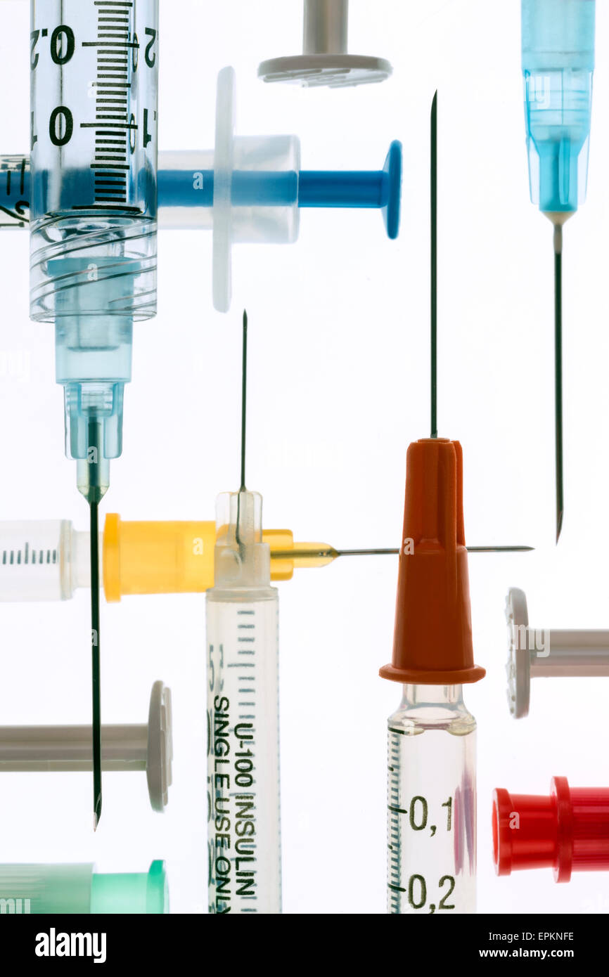 Medical syringes and needles - used for giving injections of drugs in the treatment of illness and disease. Stock Photo