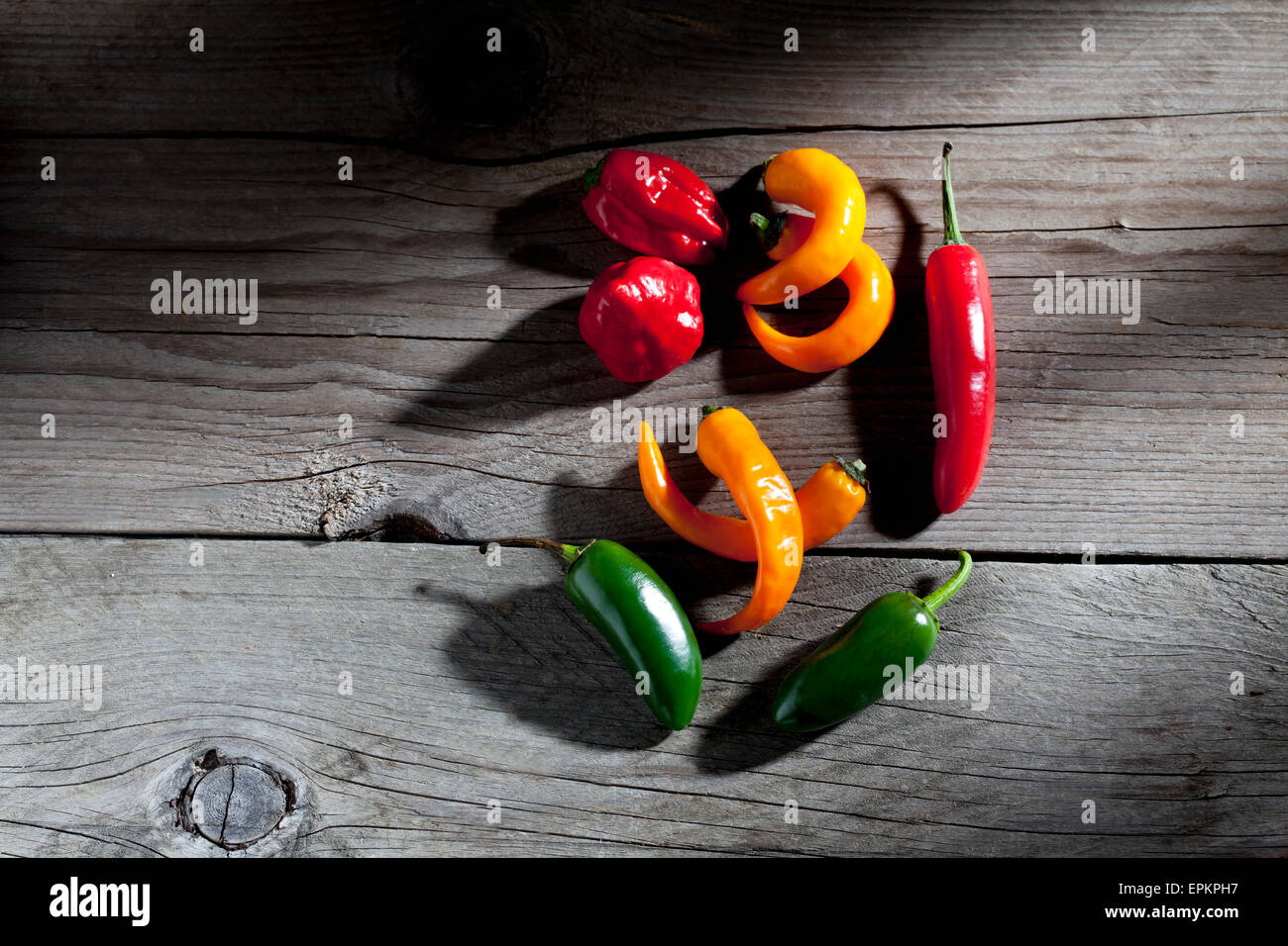 Multicolored chili peppers Stock Photo