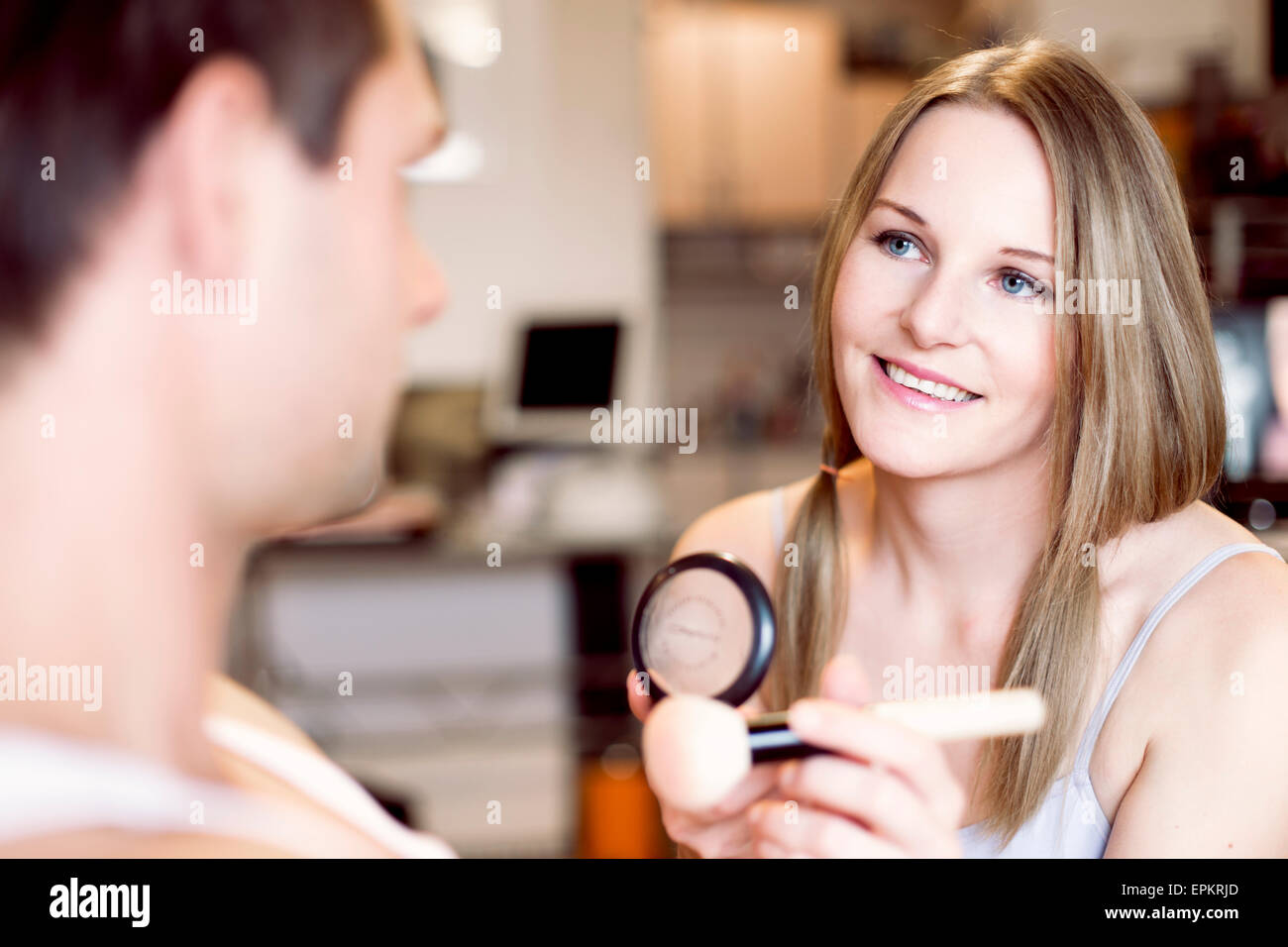 Portrait of smiling woman with beauty brush Stock Photo