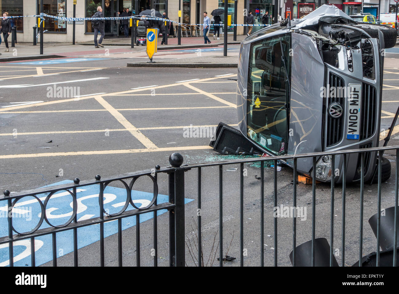 London, UK. 19th May, 2015. A VW car crashes onto its side at the junction of Balham Hill and Clapham South. The air ambulance and fire engines attended the scene and now it is being investigated by Traffic Police and documented by a Police photographer. London UK 19 May 2015. Credit:  Guy Bell/Alamy Live News Stock Photo