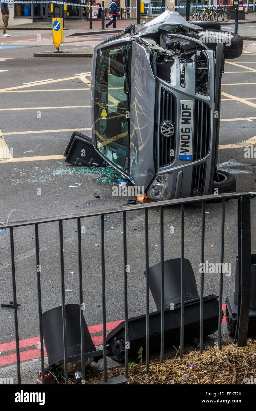 London, UK. 19th May, 2015. A VW car crashes onto its side at the junction of Balham Hill and Clapham South. The air ambulance and fire engines attended the scene and now it is being investigated by Traffic Police and documented by a Police photographer. London UK 19 May 2015. Credit:  Guy Bell/Alamy Live News Stock Photo