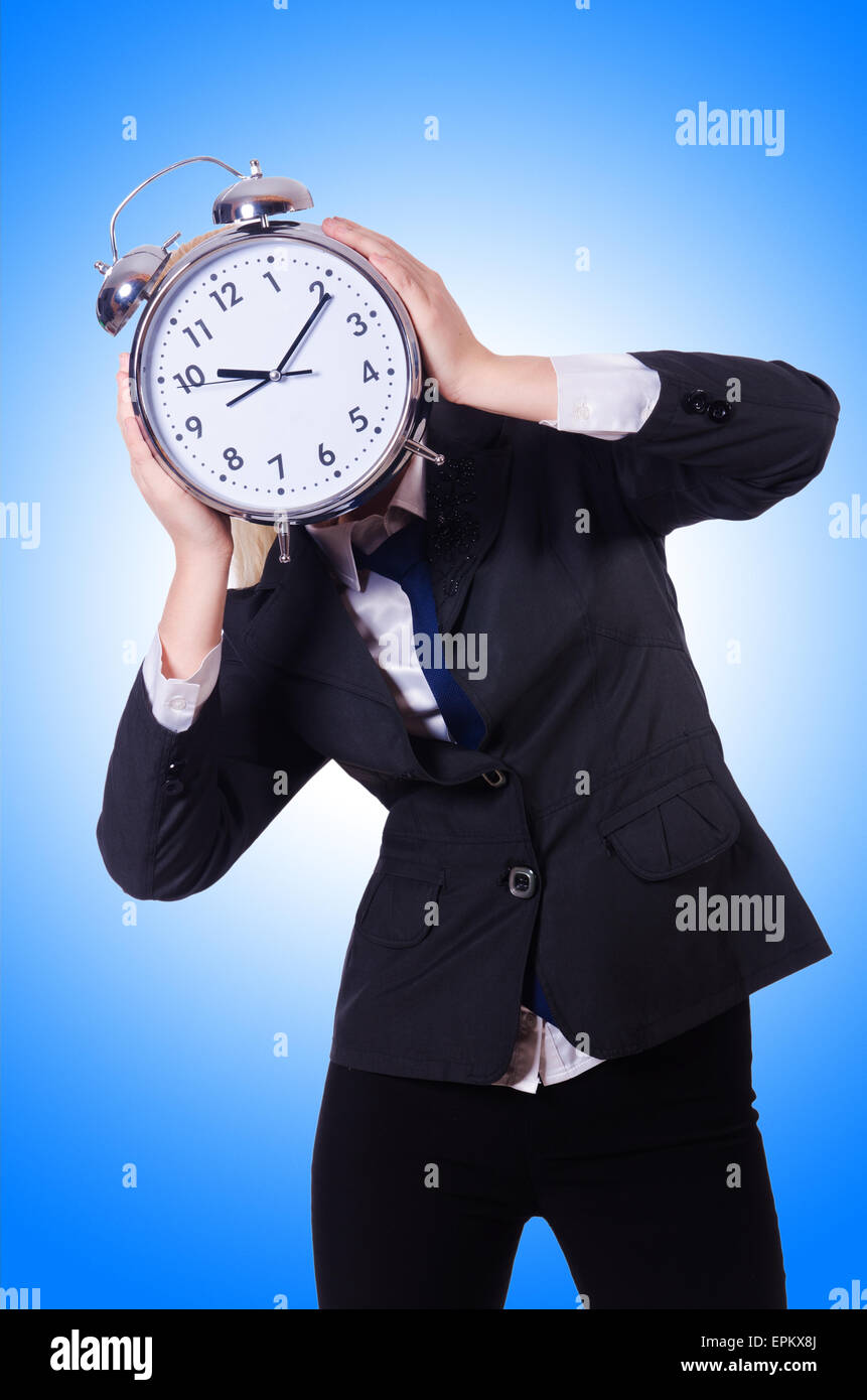 Woman with giant clock on white Stock Photo - Alamy