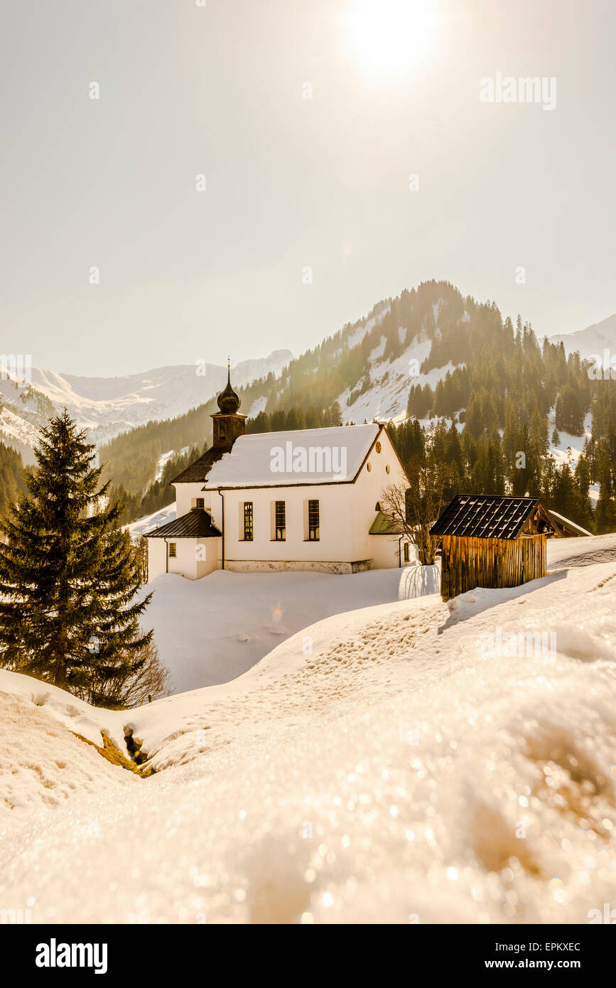 Austria, Kleinwalsertal, Baad, St Martin's Church in winter Stock Photo