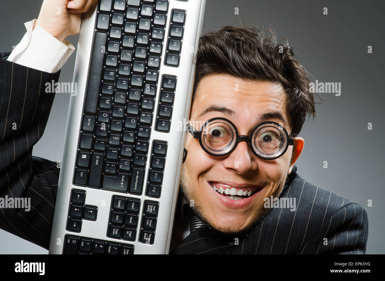 Computer geek with computer keyboard Stock Photo - Alamy