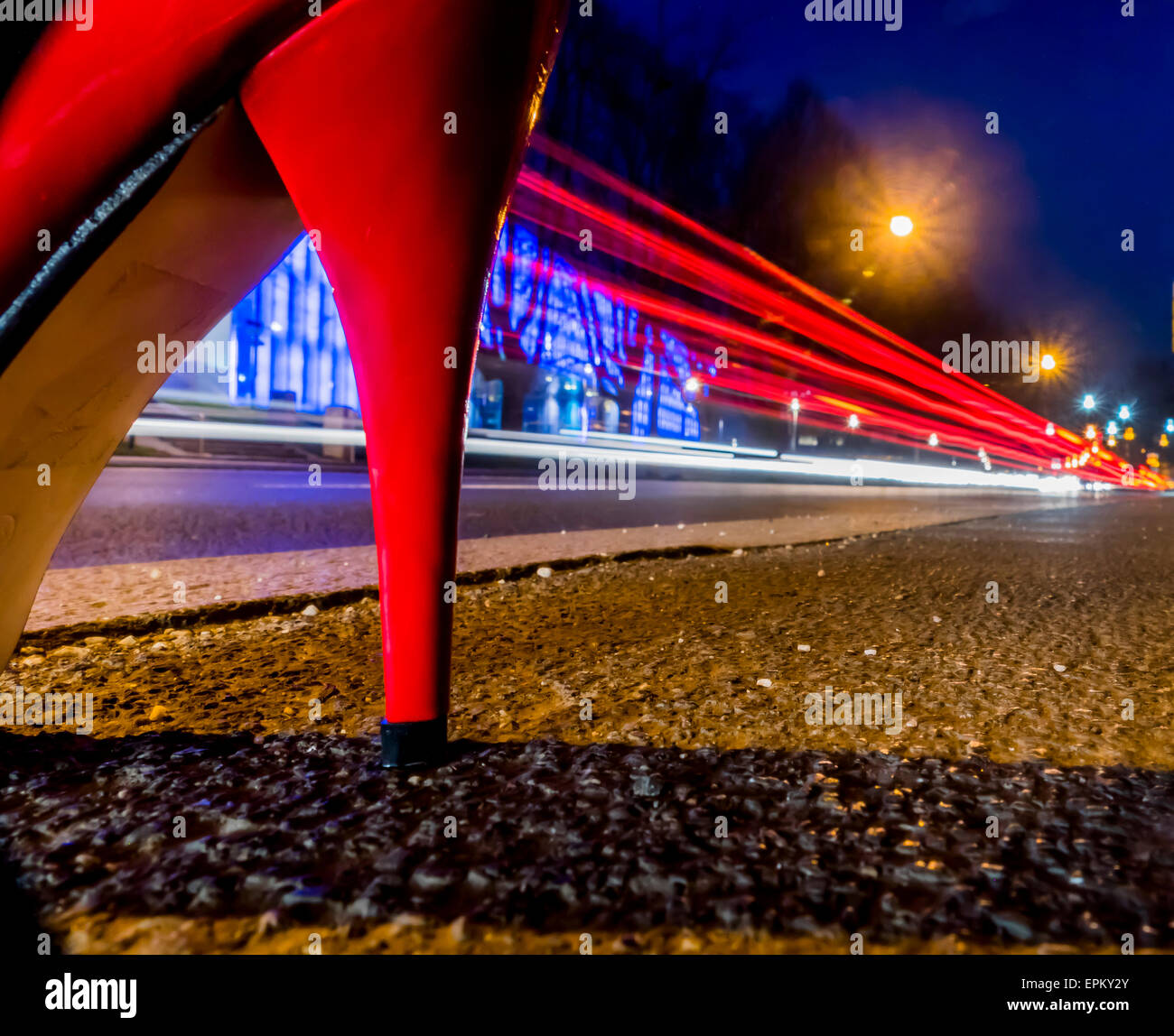 Red high heel and tail lights at night Stock Photo