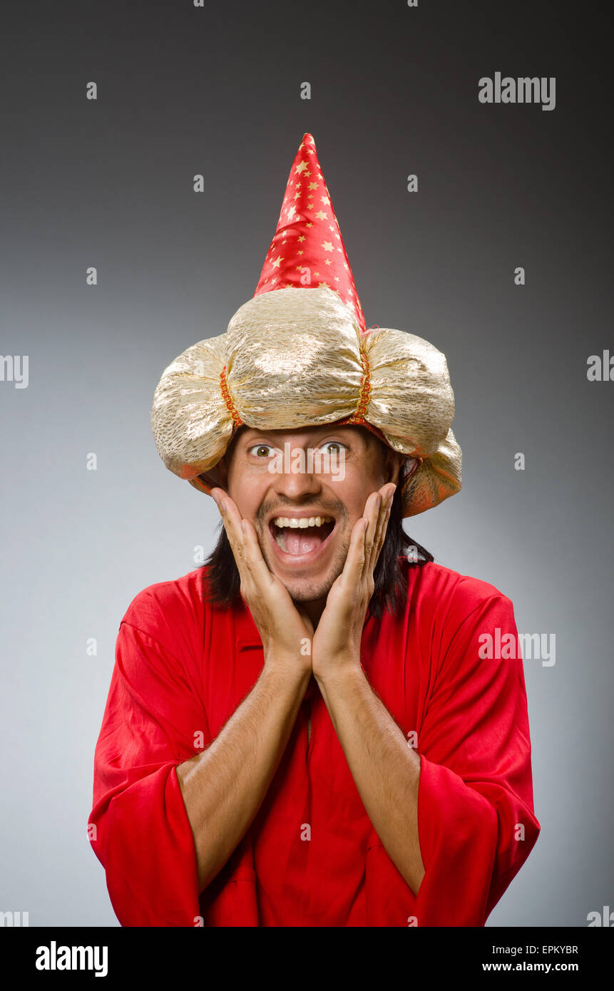 Funny wizard wearing red dress Stock Photo - Alamy