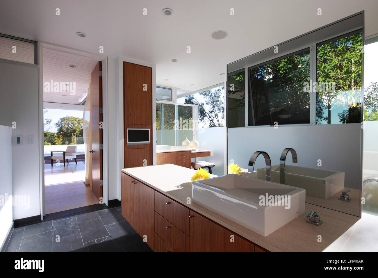 Wash basin and mirror in modern glasswalled bathroom, Seabright