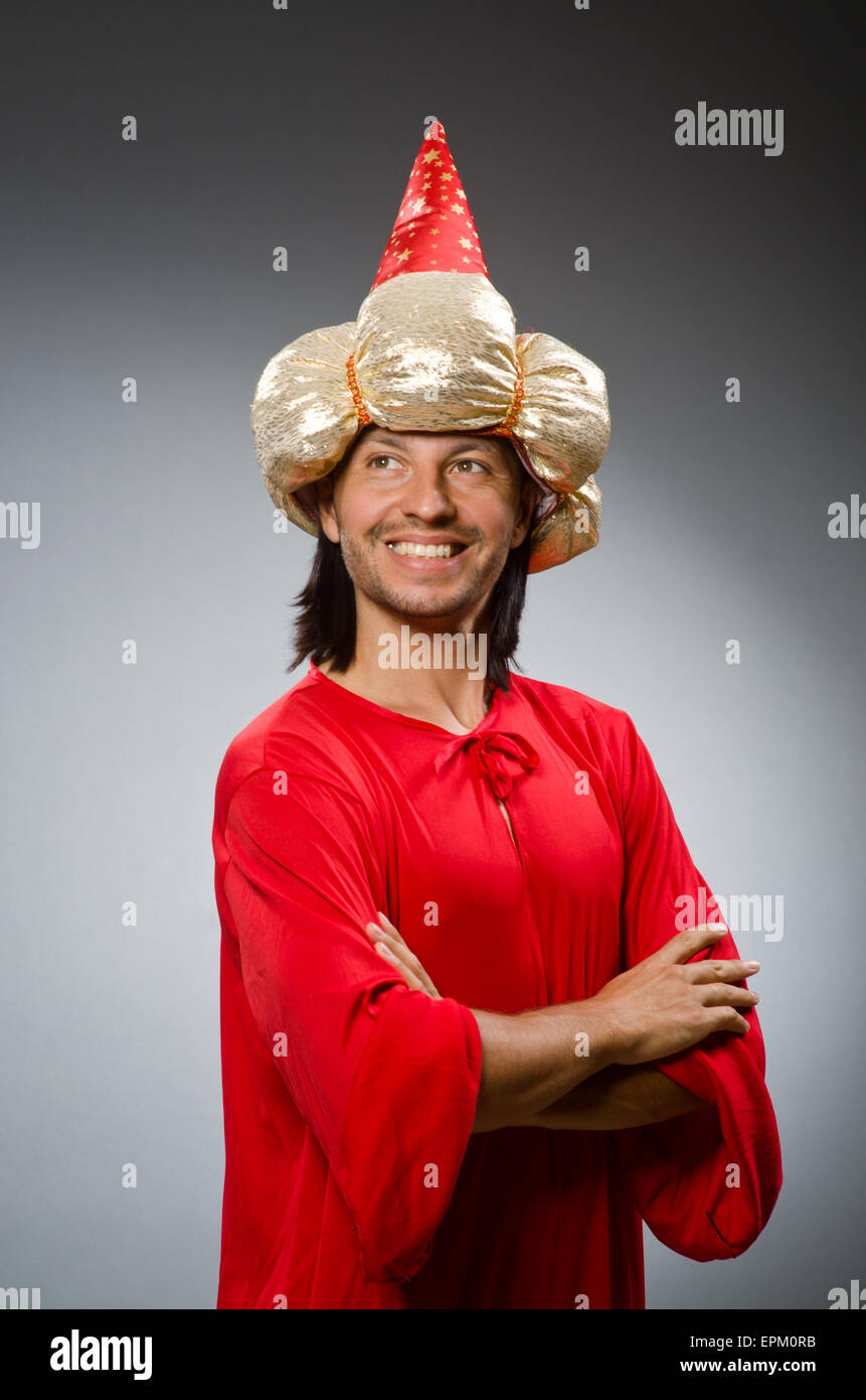 Funny wizard wearing red dress Stock Photo - Alamy