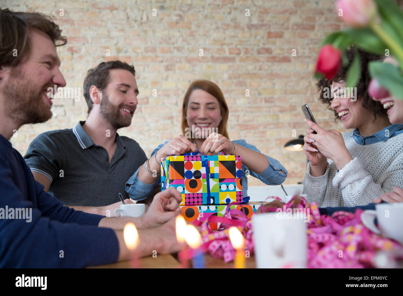 Group of friends celebrating birthday Stock Photo - Alamy
