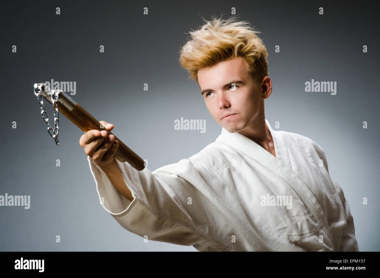 Funny karate fighter with nunchucks Stock Photo Alamy