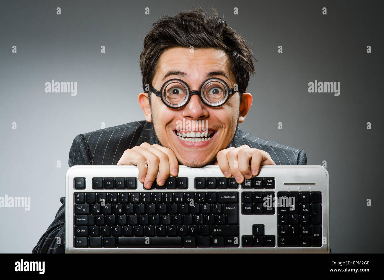 Computer geek with computer keyboard Stock Photo