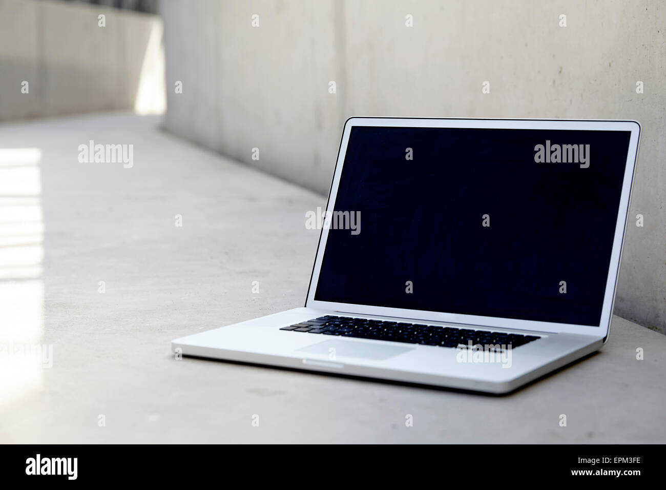 Computer Like Floor Laptop on concrete floor Stock Photo - Alamy