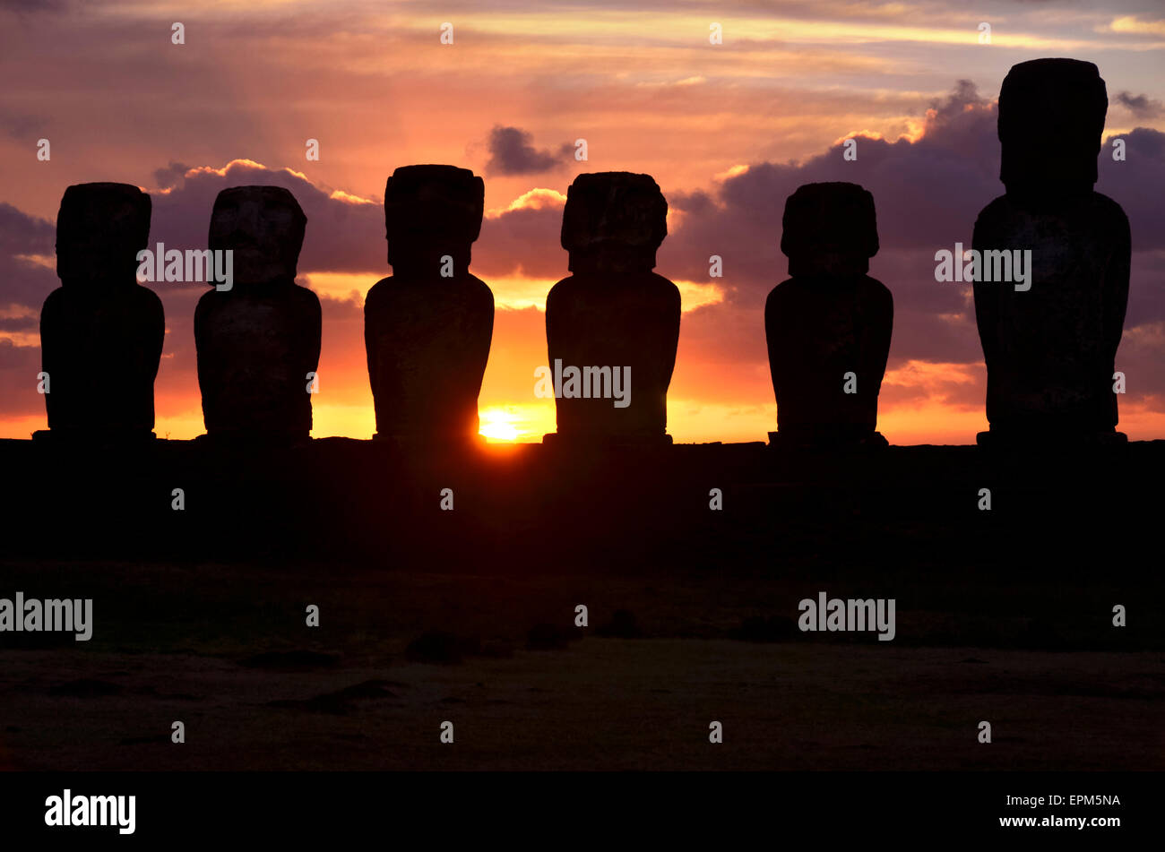 Chile, Easter Island, row of moais at Ahu Tongariki at sunrise, Rapa Nui National Park Stock Photo