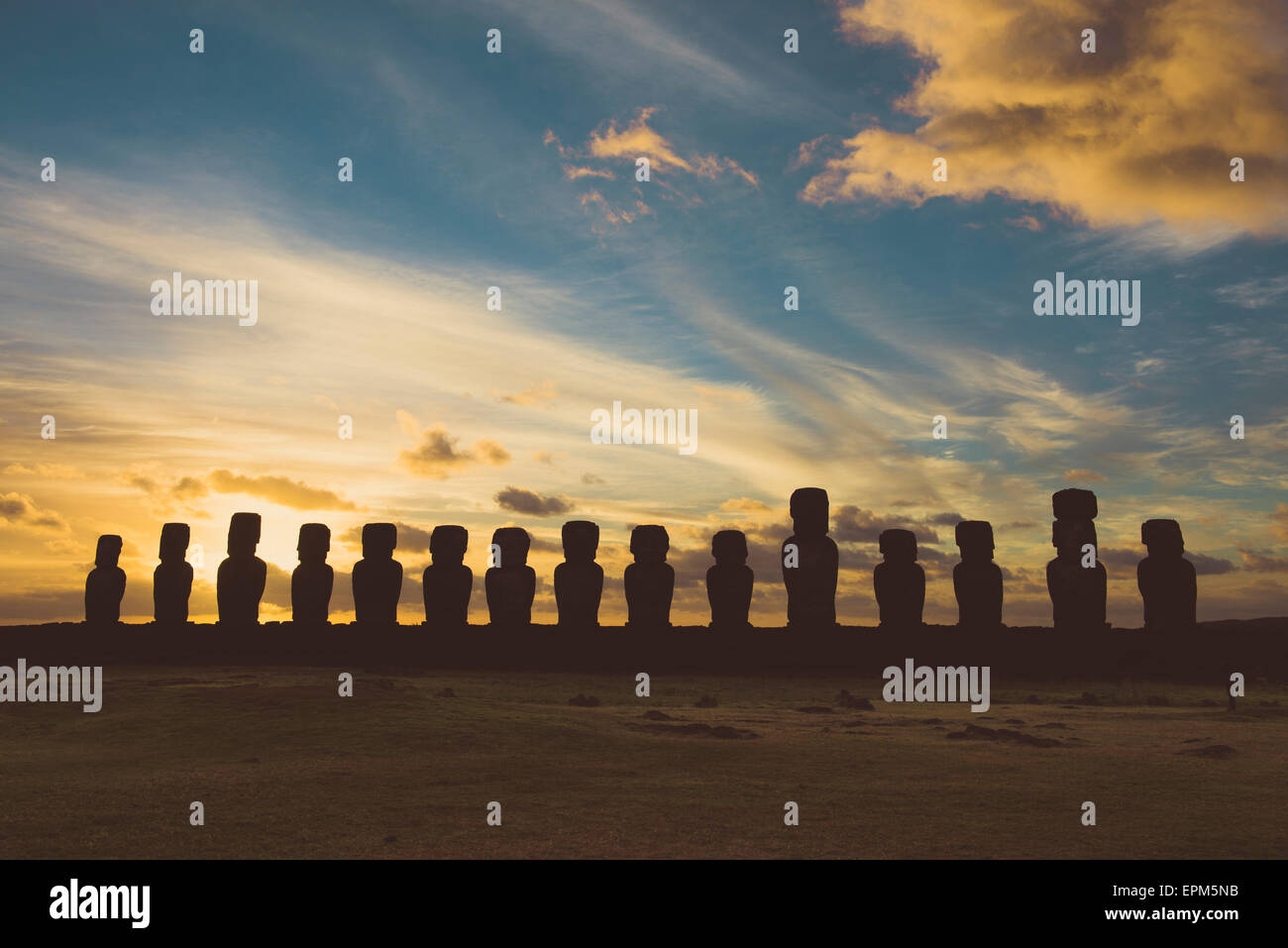 Chile, Easter Island, row of moais at Ahu Tongariki at sunrise, Rapa Nui National Park Stock Photo