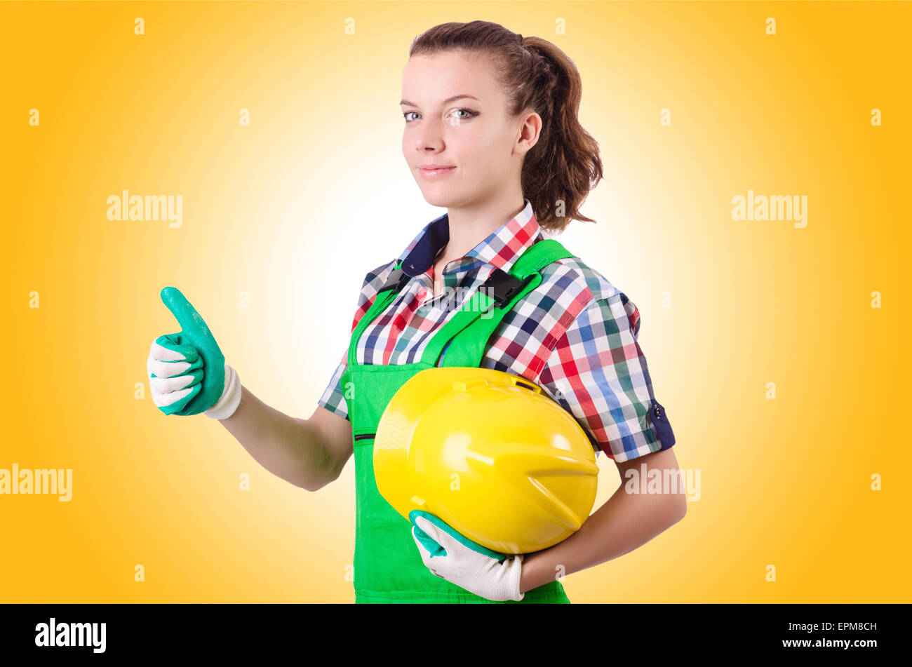 Woman builder isolated on the white Stock Photo - Alamy