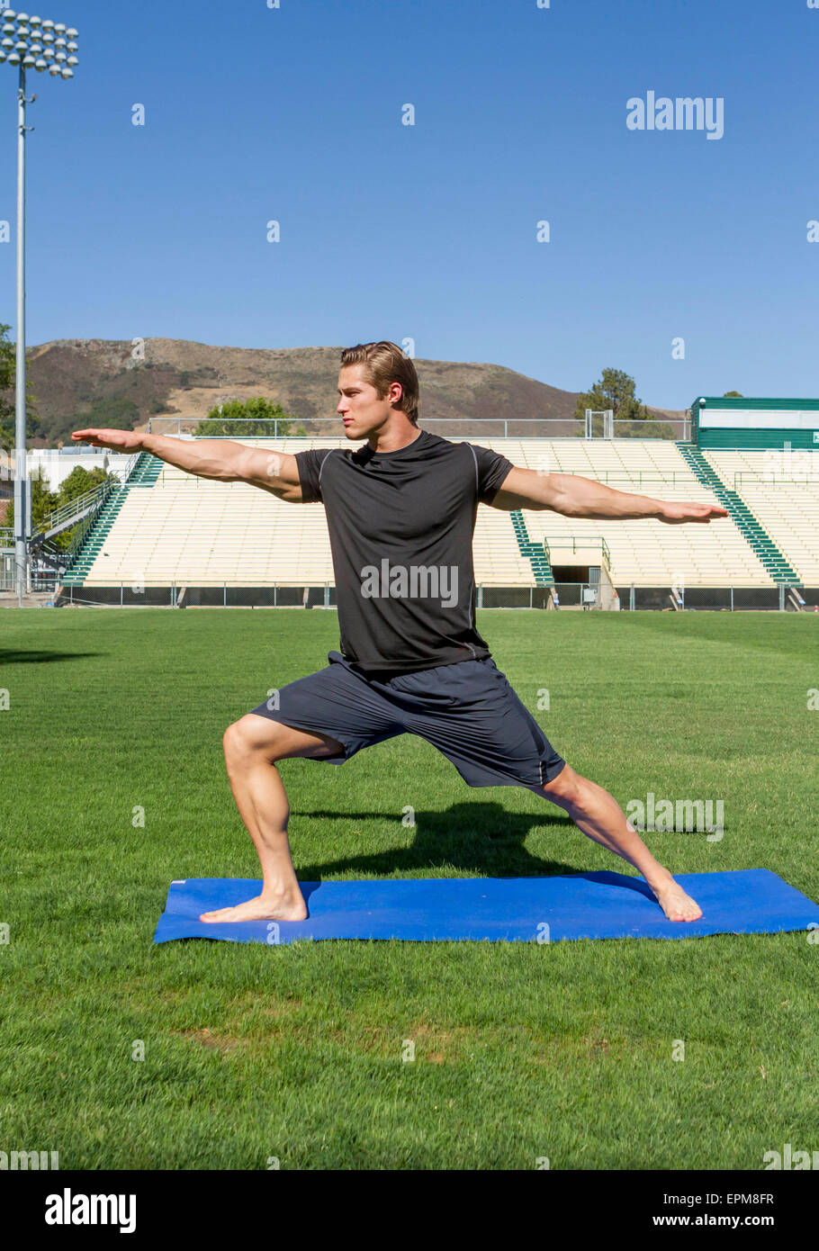 USA, California, San Luis Obispo, young man doing workout on an athletic field Stock Photo
