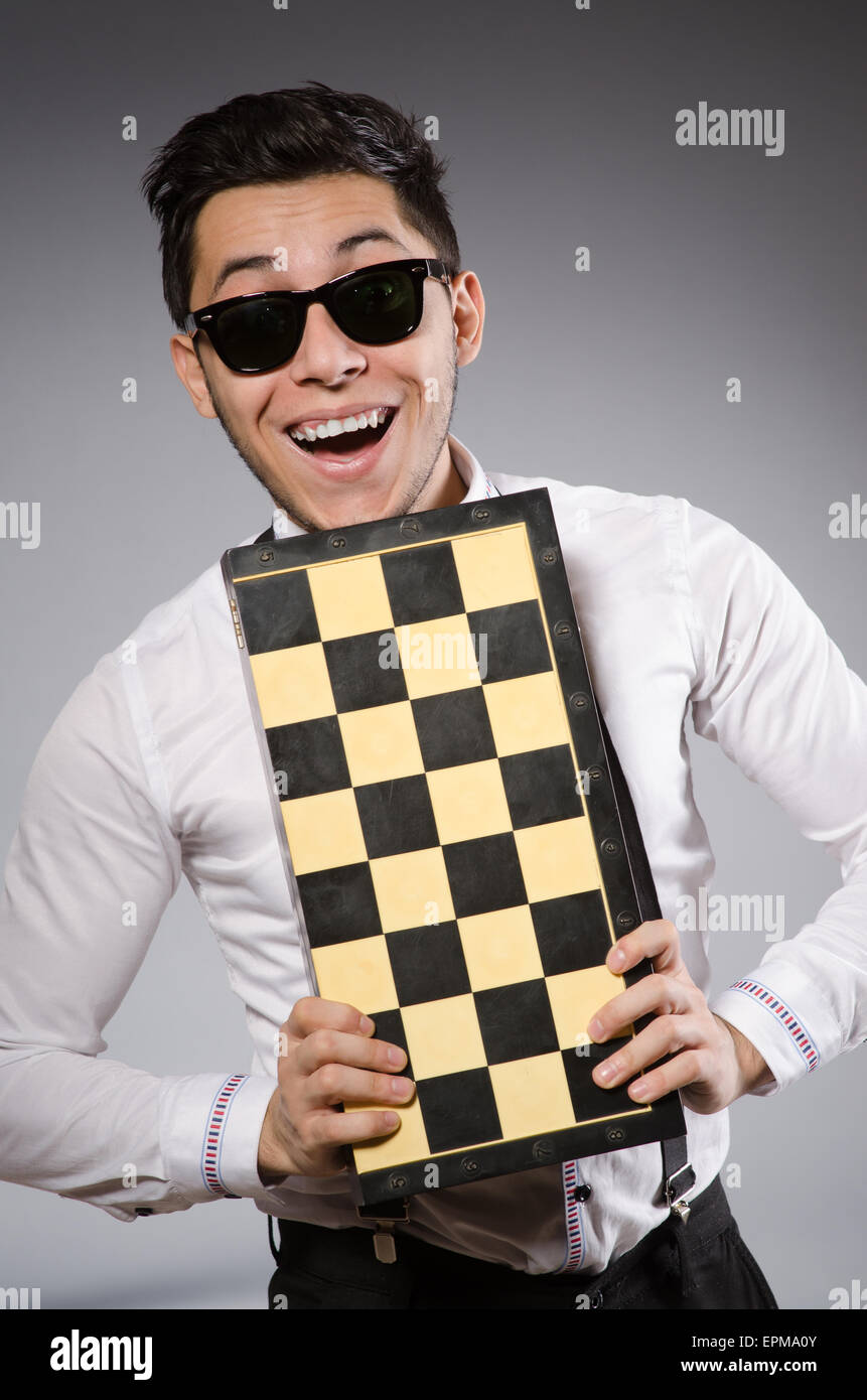 Funny chess player with board Stock Photo