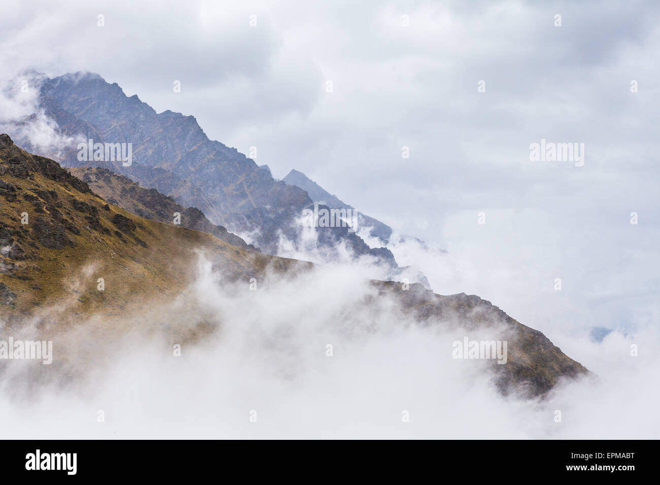 Rugged peaks showing above clouds at the Remarkables Ski Area, Queenstown, New Zealand. Stock Photo