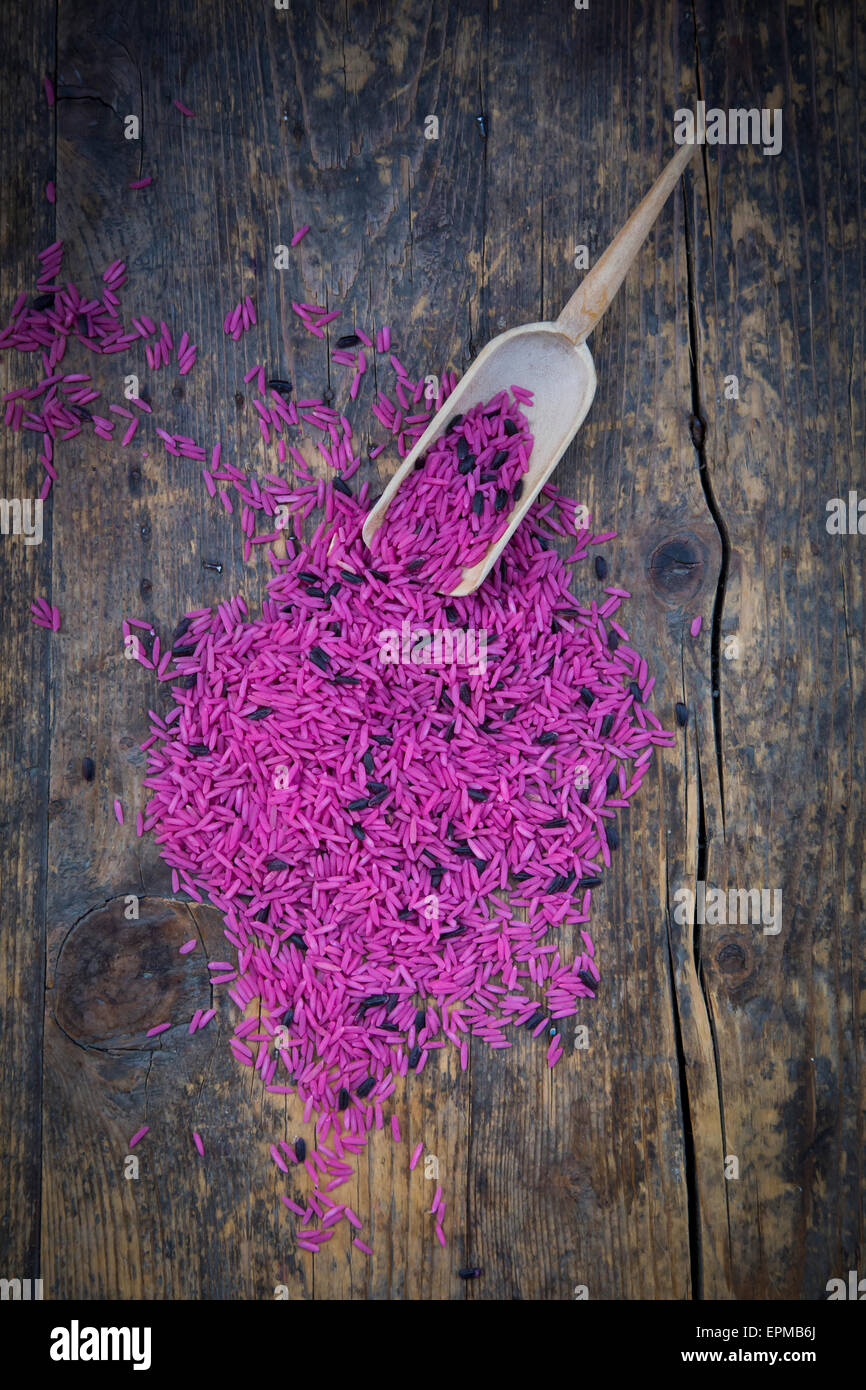 Pink organic basmati rice and small shovel Stock Photo Alamy