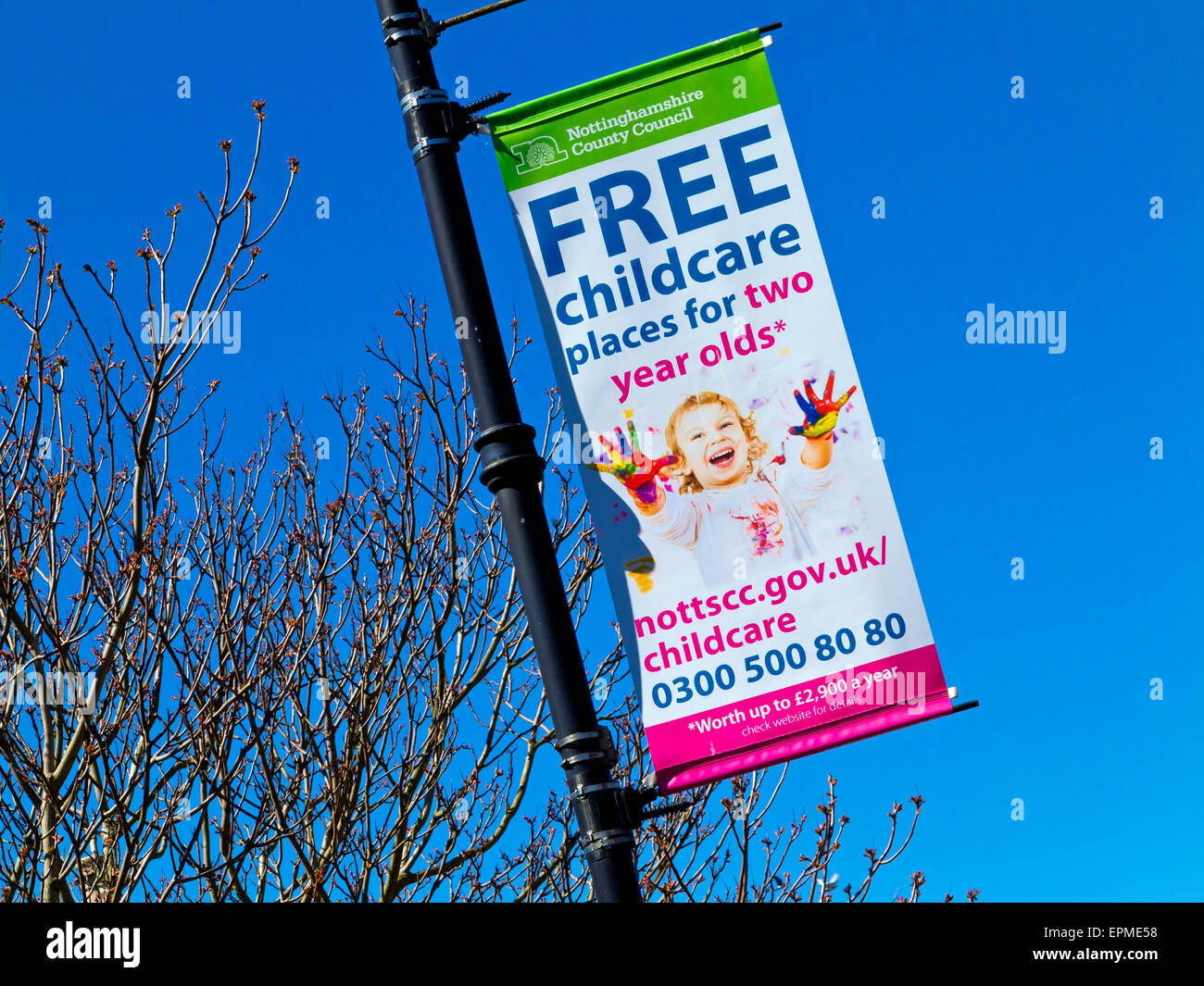 Nottinghamshire County Council Free childcare places for two year olds banner on a lamp post in Newark on Trent England UK Stock Photo