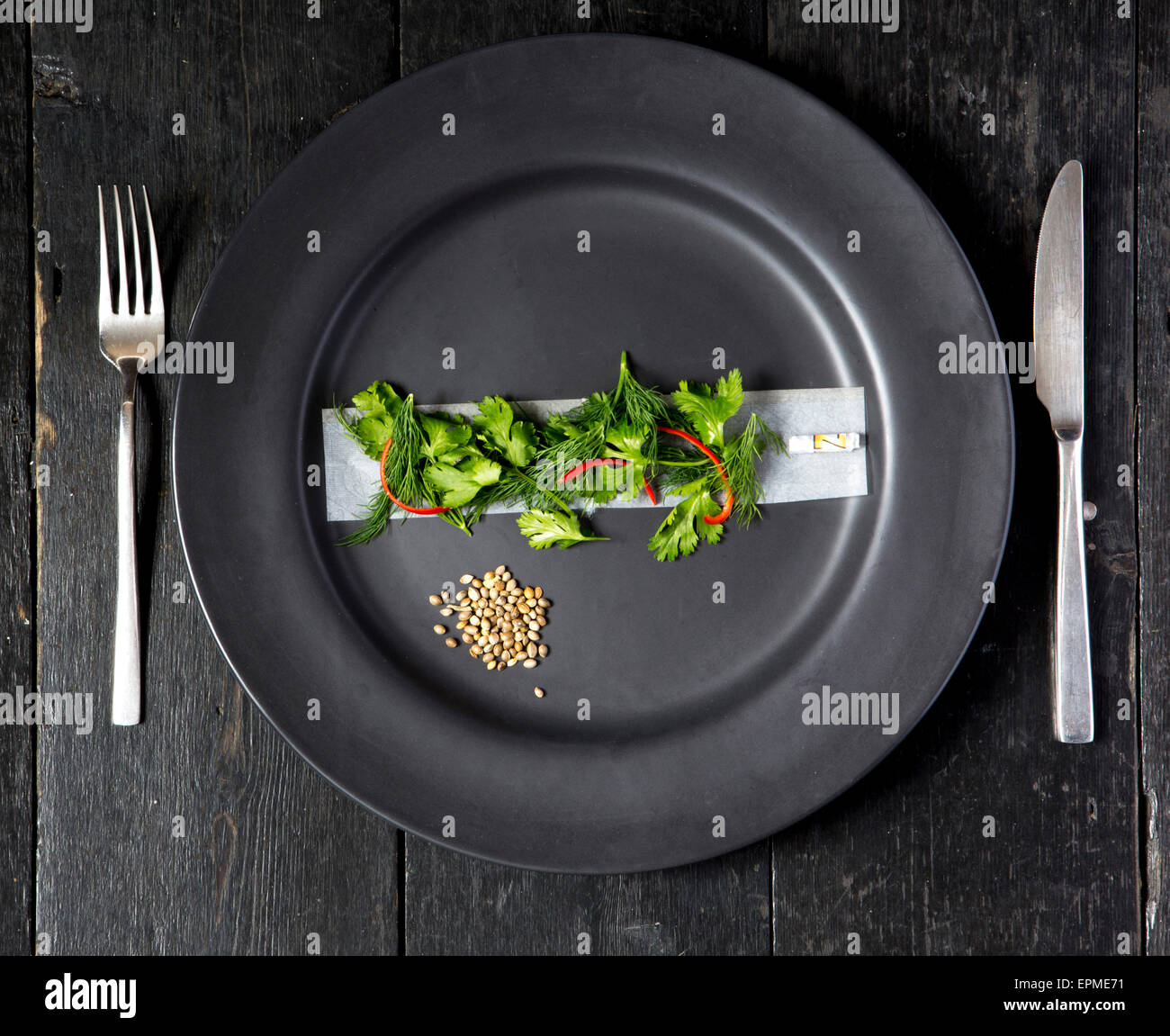 Humorous depiction of a hemp inspired meal featuring hemp seeds, coriander, rizlas. Stock Photo
