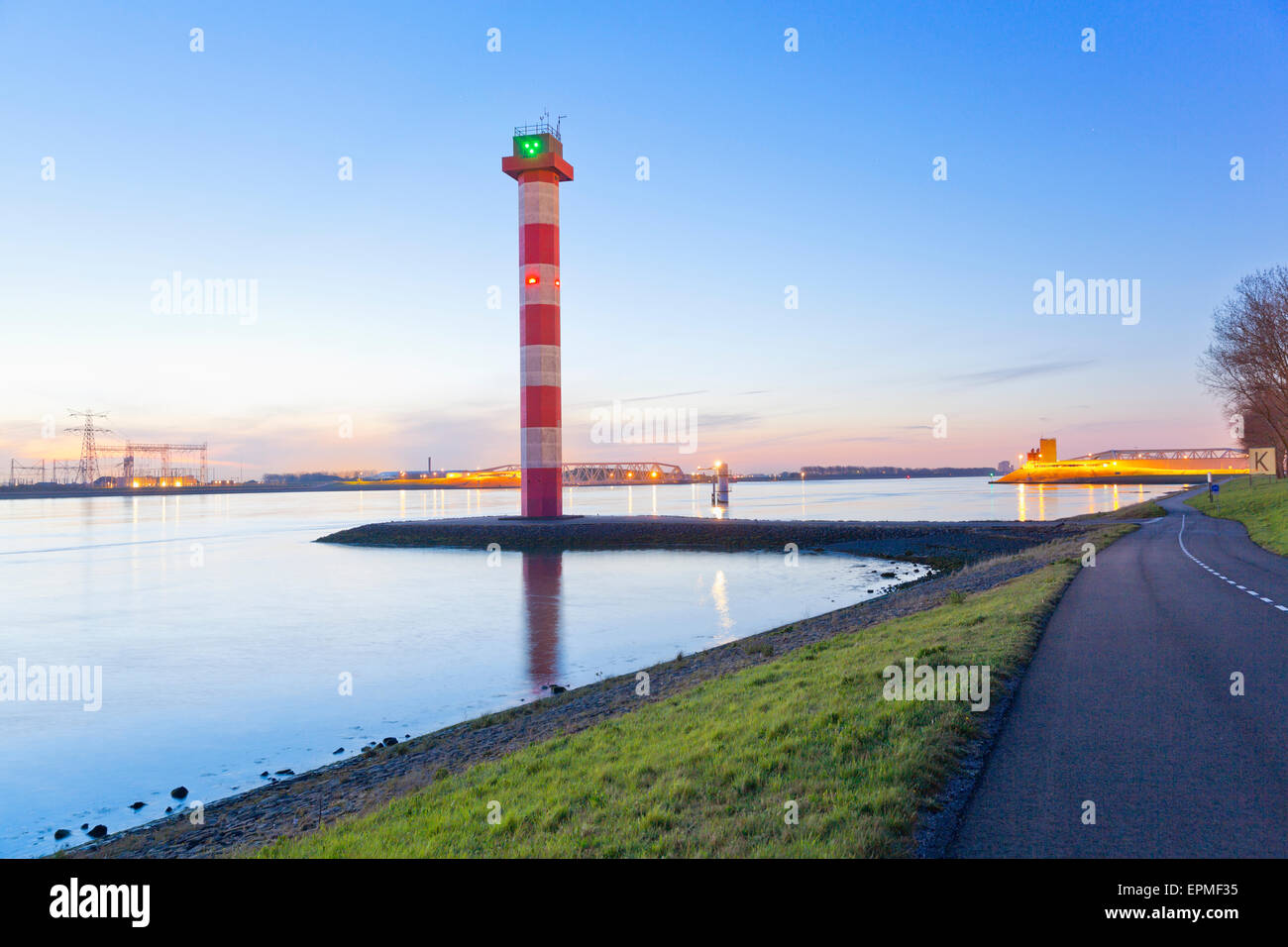 Netherlands, Lighthouse and harbour entrance of Rotterdam in the evening Stock Photo