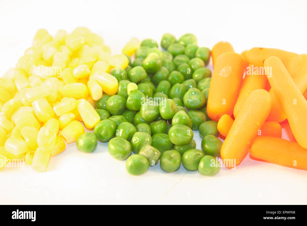 Yellow corn, green peas and orange carrots Stock Photo Alamy