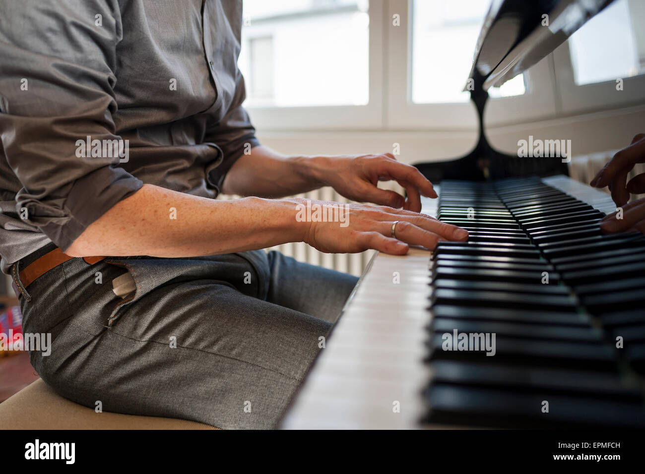 Man playing grand piano Stock Photo - Alamy