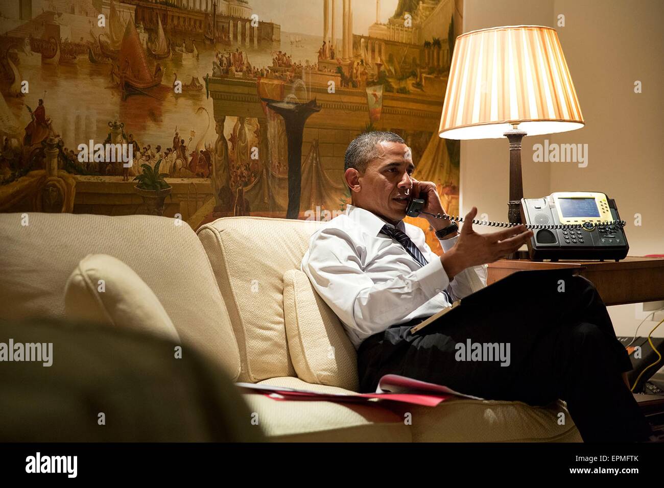 U.S. President Barack Obama talks on the phone with European leaders to consult about the situation in eastern Ukraine April 25, 2104 in Seoul, Republic of Korea. The President spoke with President Franois Hollande of France, Chancellor Angela Merkel of Germany, Prime Minister Matteo Renzi of Italy, and Prime Minister David Cameron of the United Kingdom from his hotel suite in Seoul. Stock Photo