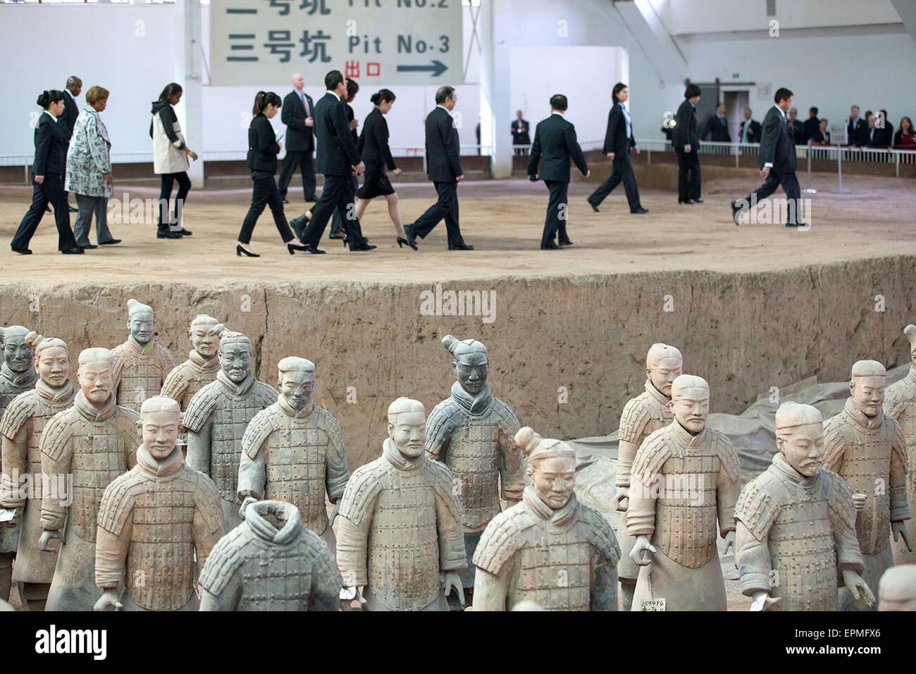 First Lady Michelle Obama walks along with daughters Sasha and Malia, and mother Marian Robinson as they tour the Terra Cotta Warriors museum March 24, 2014 in Xian, China. Stock Photo