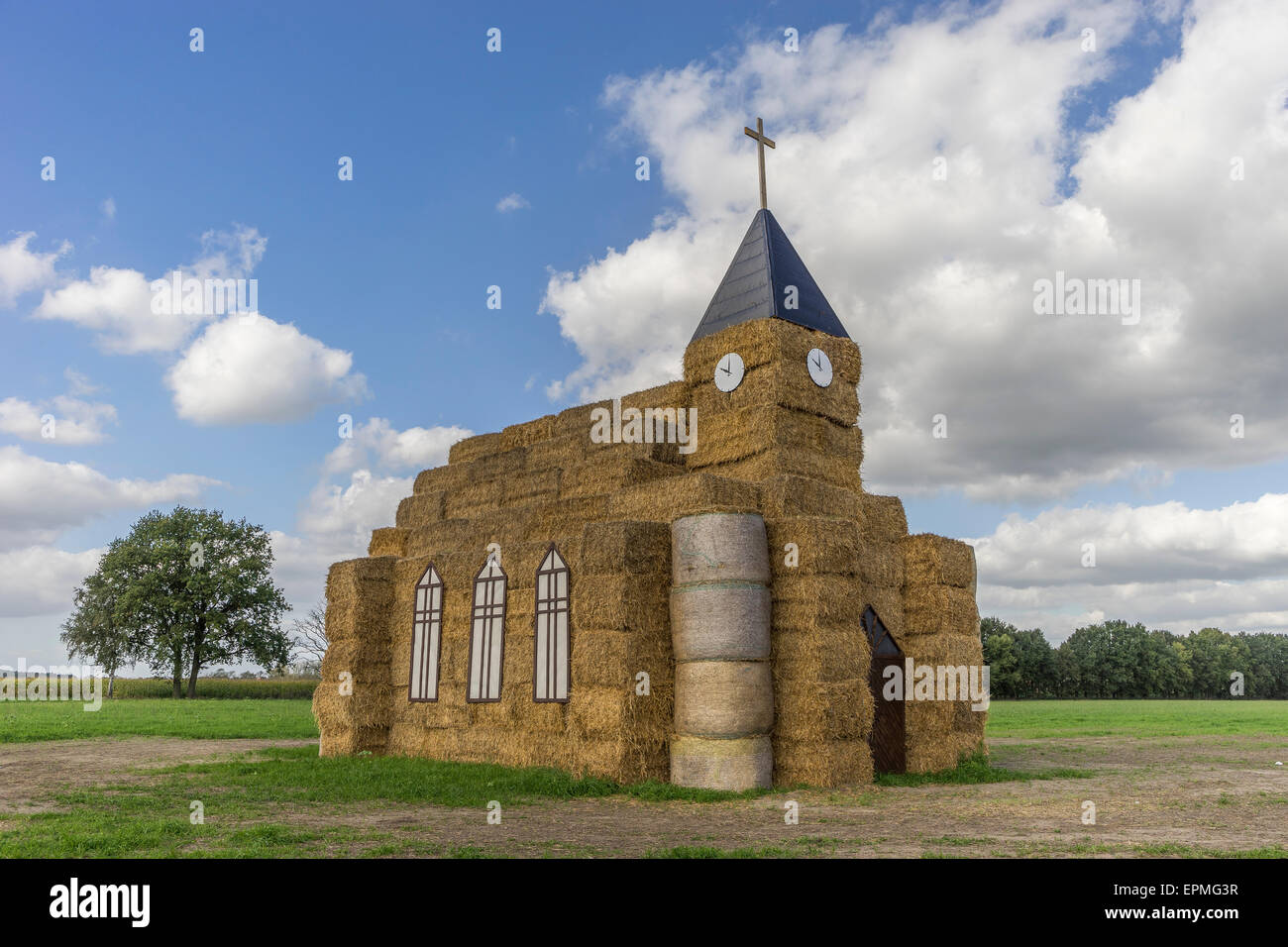 Germany, Ludwigslust-Parchim, Church made of hey bales for harvest festival Stock Photo