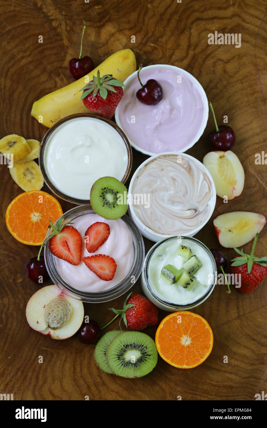 assortment of different yogurt for breakfast with berries and fruits
