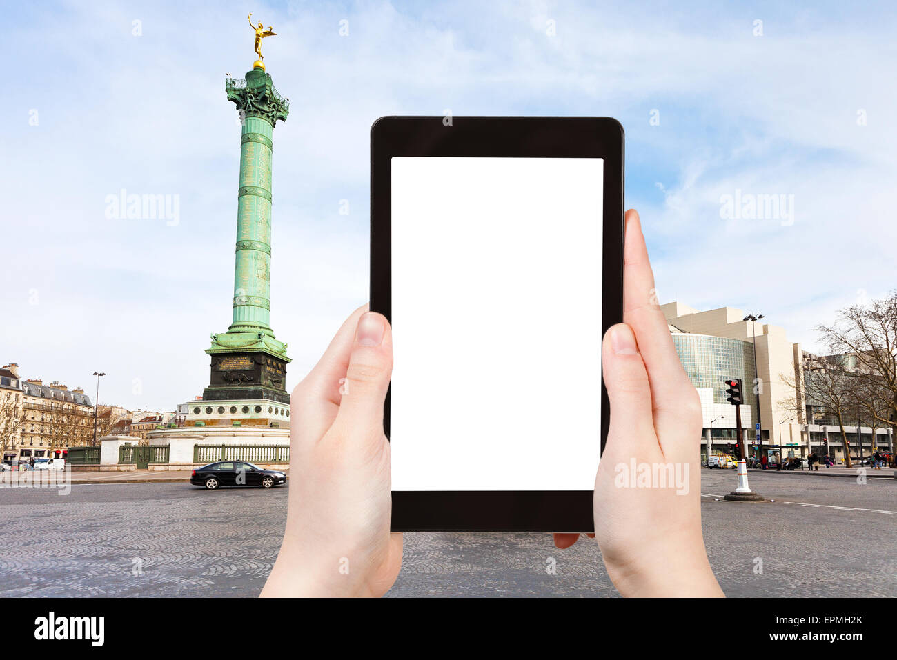 travel concept - tourist photograph Place de la Bastille and Bastille opera in Paris, France on tablet pc with cut out screen wi Stock Photo