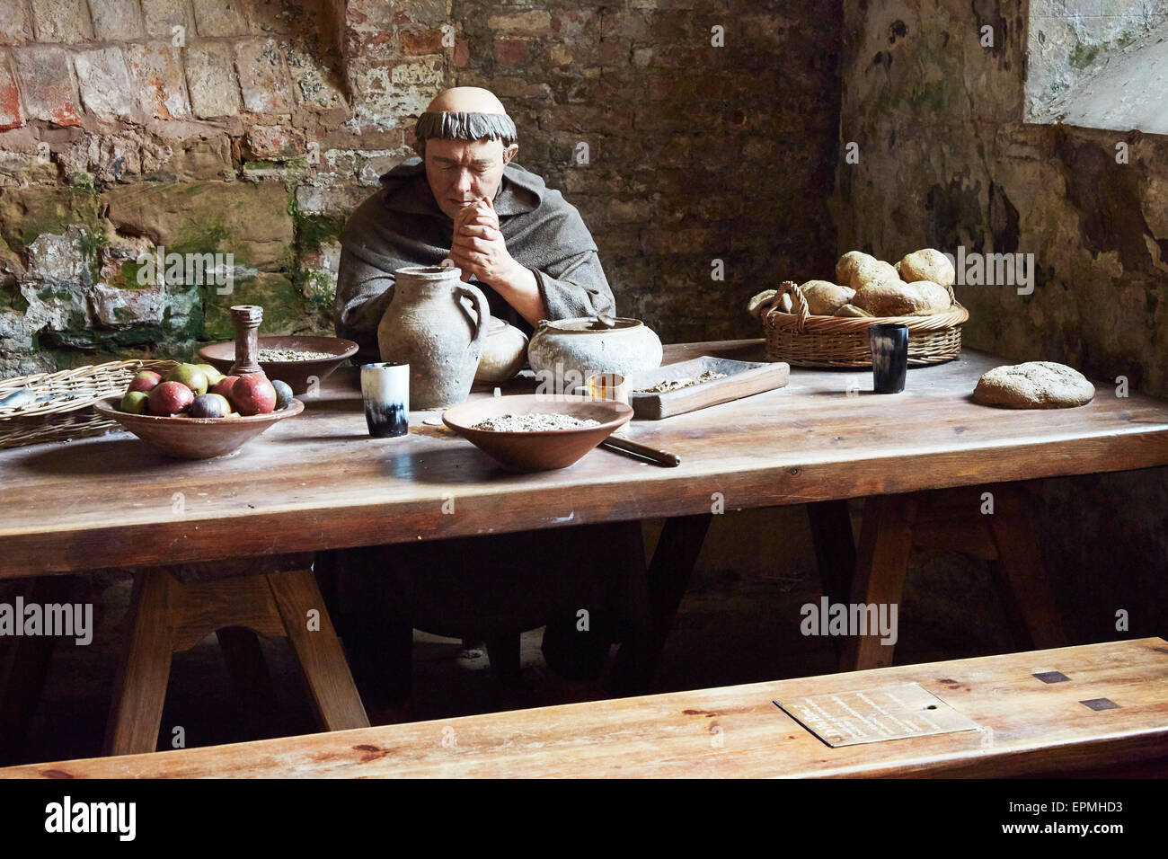 Museum display depicting a monk eating at Rufford Abbey. Stock Photo